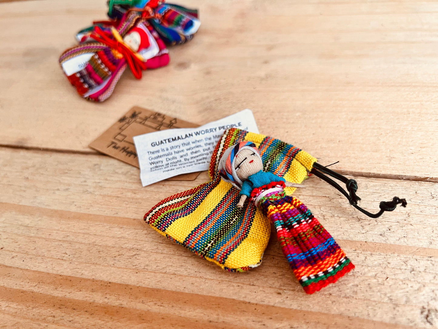 mini worry doll in fabric pouch