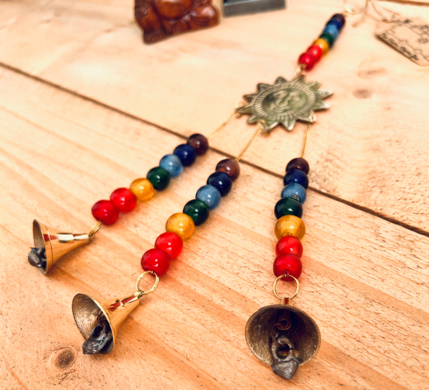 handmade mini brass sun sunshine bells, smiling sun boho hippie colourful wind chime bells, fair trade, ethical, hanging mini recycled brass bell chime