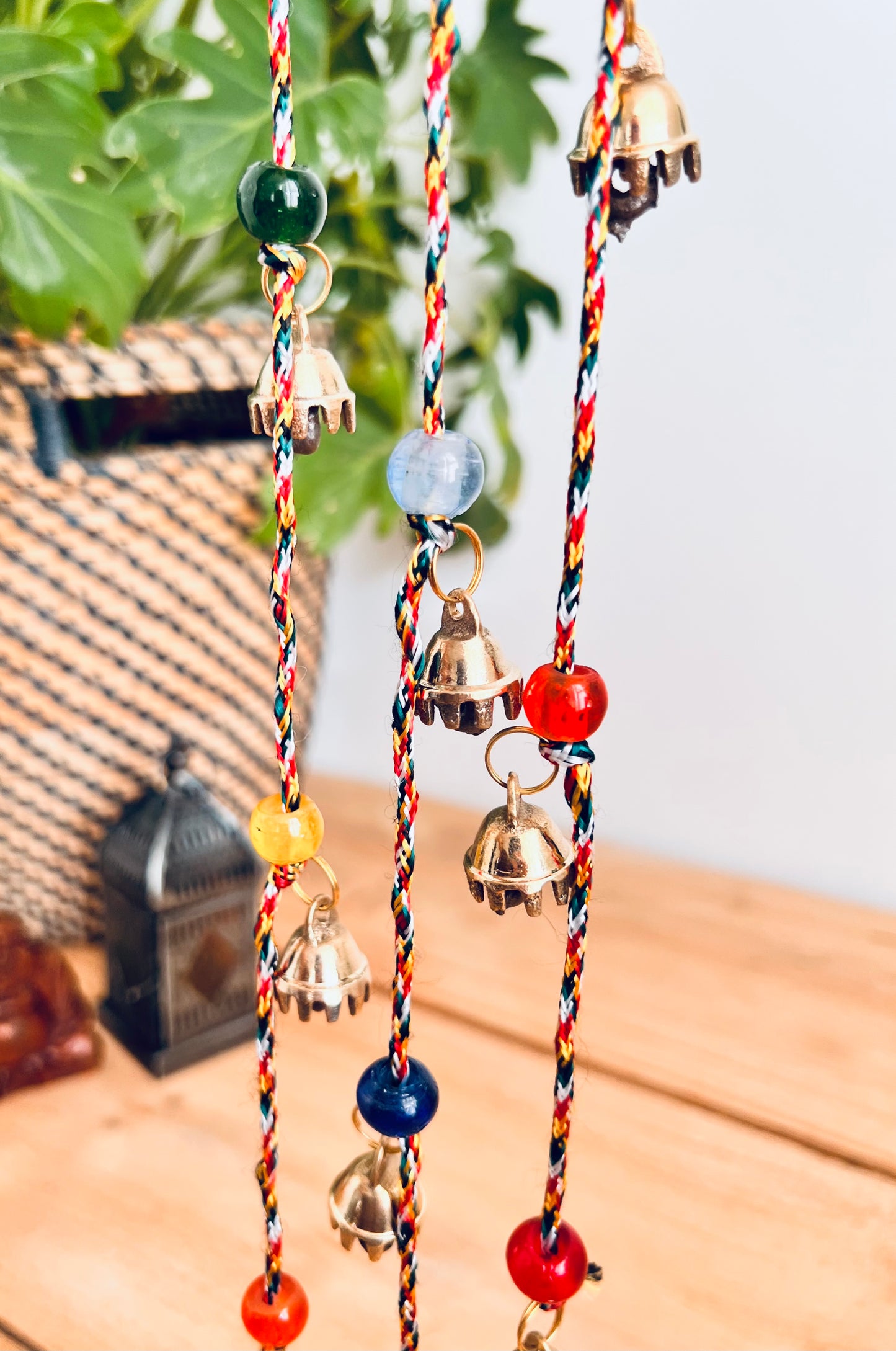 Mini brass Indian hanging string of bells, recycled metal, handmade, fair trade, ethically sourced, traditional metal wind chime bells, long garland string bells, boho, hippie, bohemian home decor