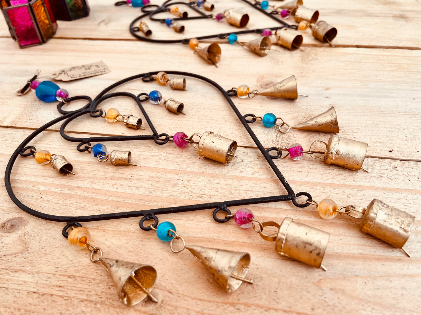 Recycled metal ironwork hanging heart bells wind chime indoor outdoor handmade fair trade boho hanging Indian bell chime, black hearts and gold bells with colourful beads wind bells