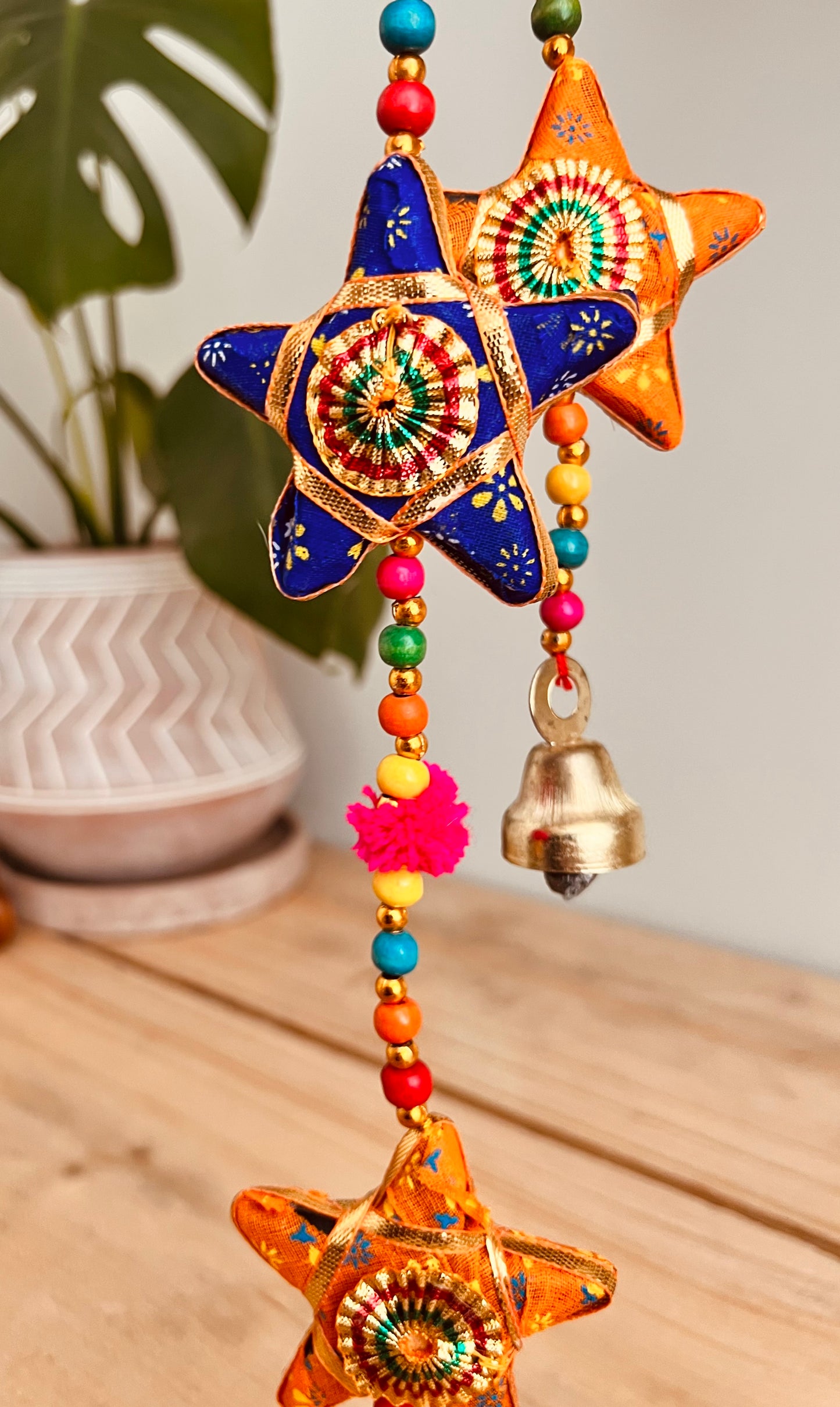 Handmade fair trade ethically sourced star and pom Pom hanging bells wind chime decoration string of stars and bell multicoloured sari fabric bells