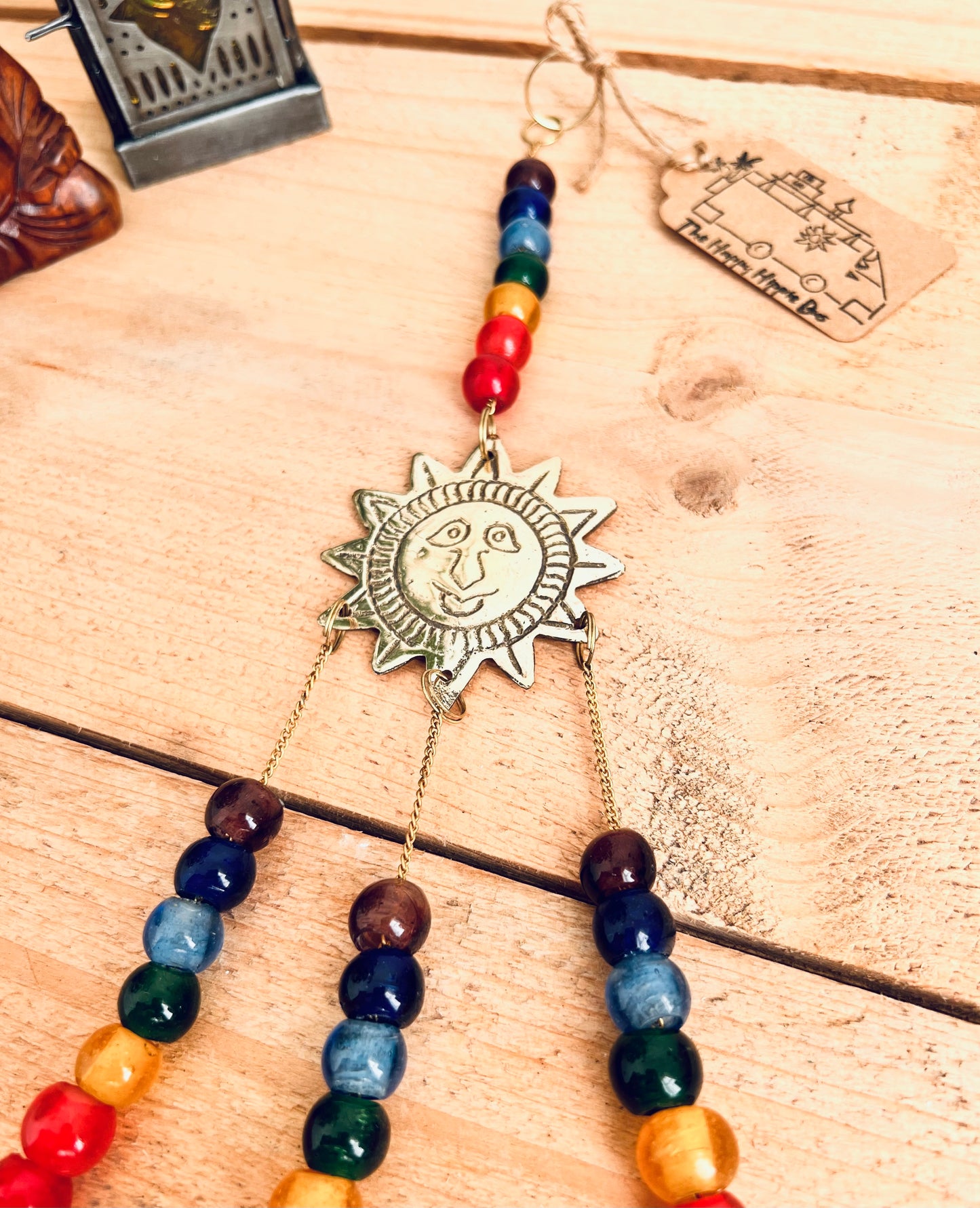handmade mini brass sun sunshine bells, smiling sun boho hippie colourful wind chime bells, fair trade, ethical, hanging mini recycled brass bell chime