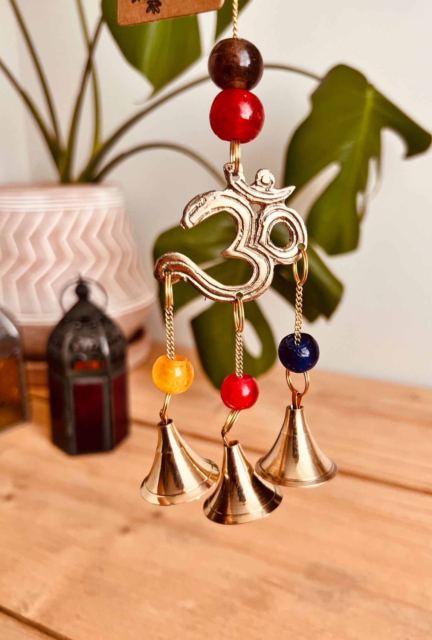 Mini brass wind chime bells Om symbol mini bell chime colourful glass beads recycled metal gold brass chime bells indoor outdoor handmade fair trade ethically sourced mini windchime