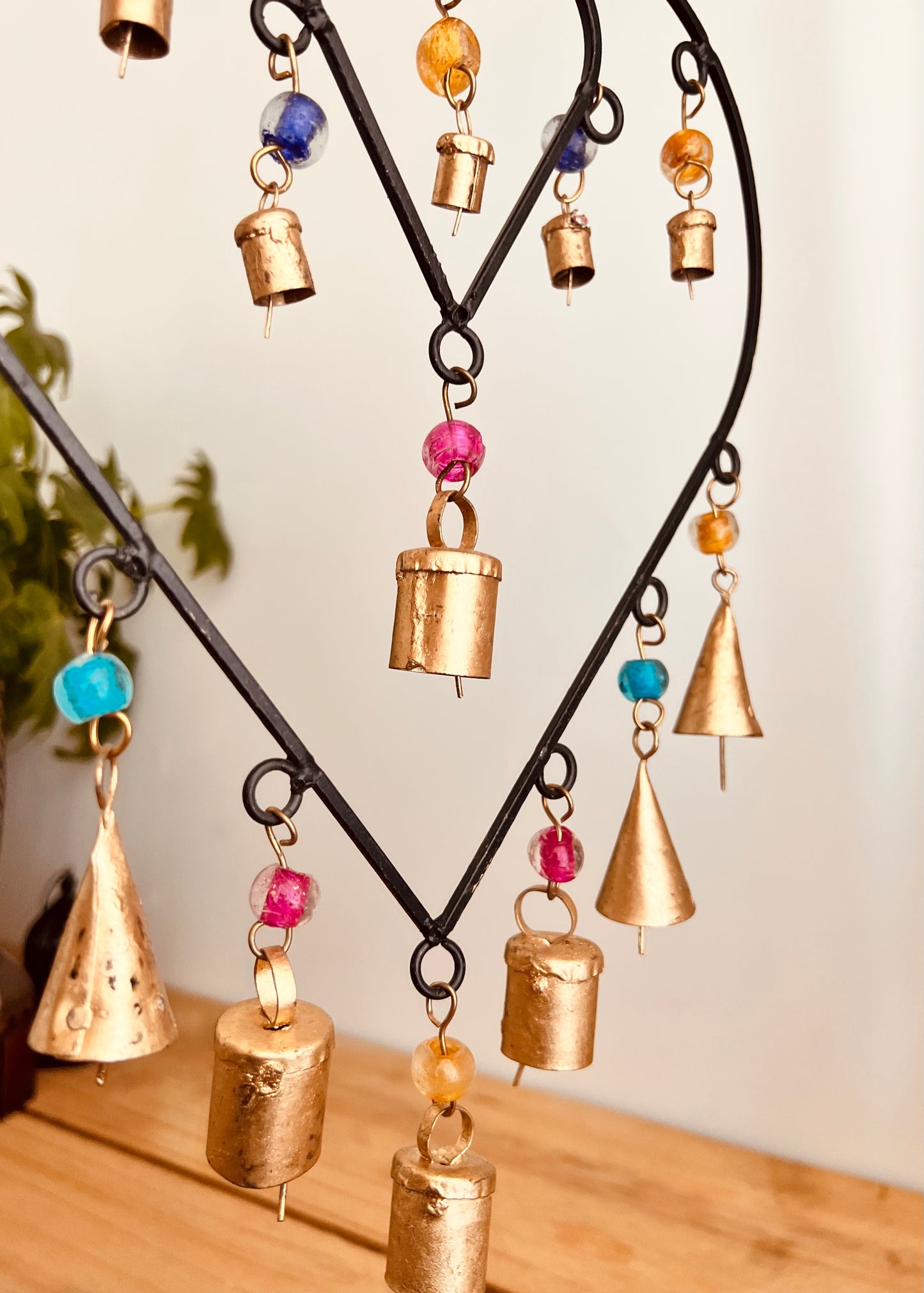 Recycled metal ironwork hanging heart bells wind chime indoor outdoor handmade fair trade boho hanging Indian bell chime, black hearts and gold bells with colourful beads wind bells