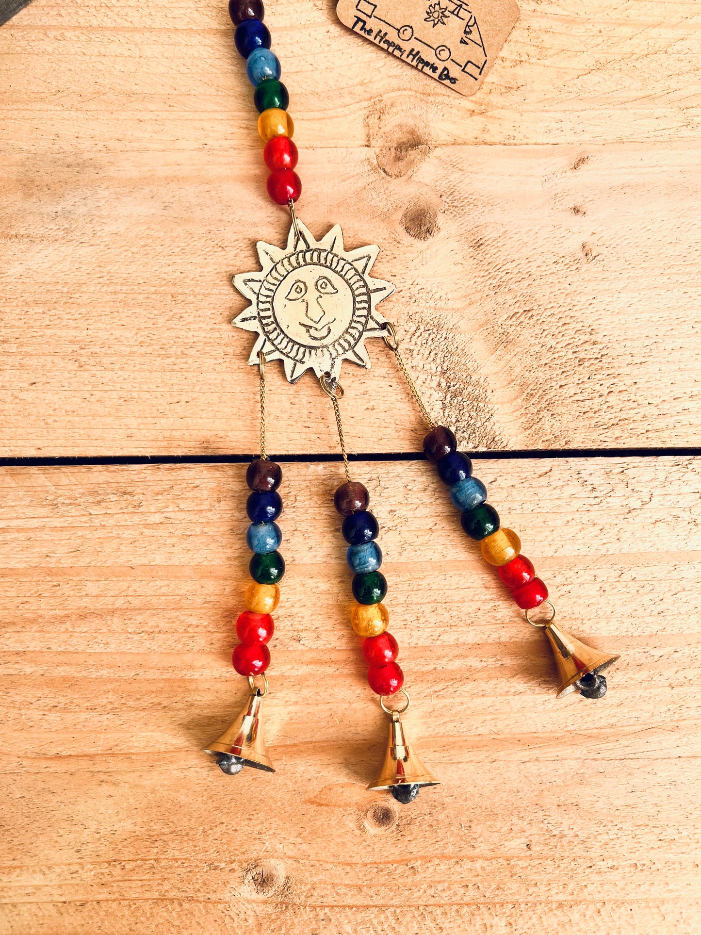 handmade mini brass sun sunshine bells, smiling sun boho hippie colourful wind chime bells, fair trade, ethical, hanging mini recycled brass bell chime