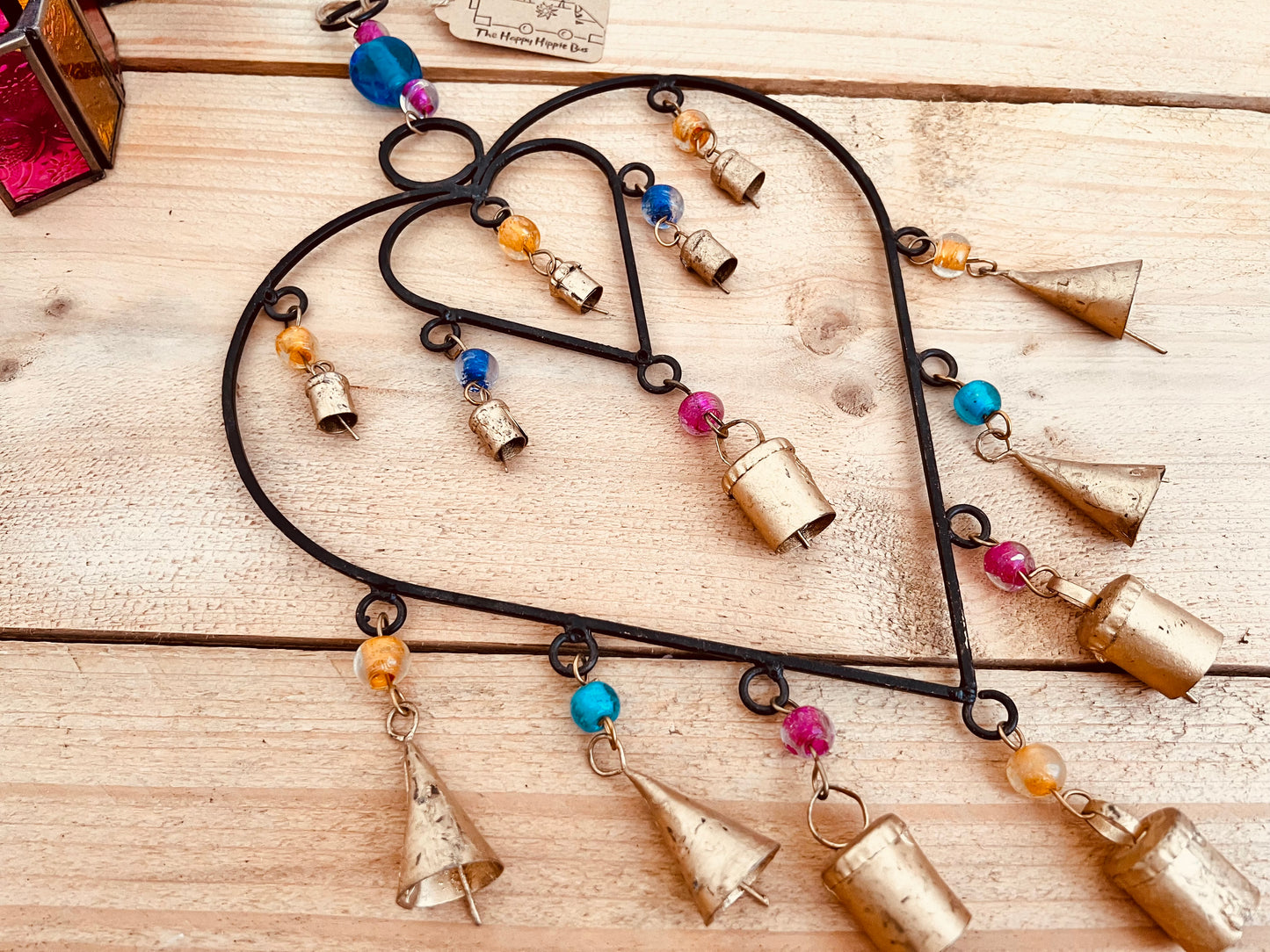 Recycled metal ironwork hanging heart bells wind chime indoor outdoor handmade fair trade boho hanging Indian bell chime, black hearts and gold bells with colourful beads wind bells