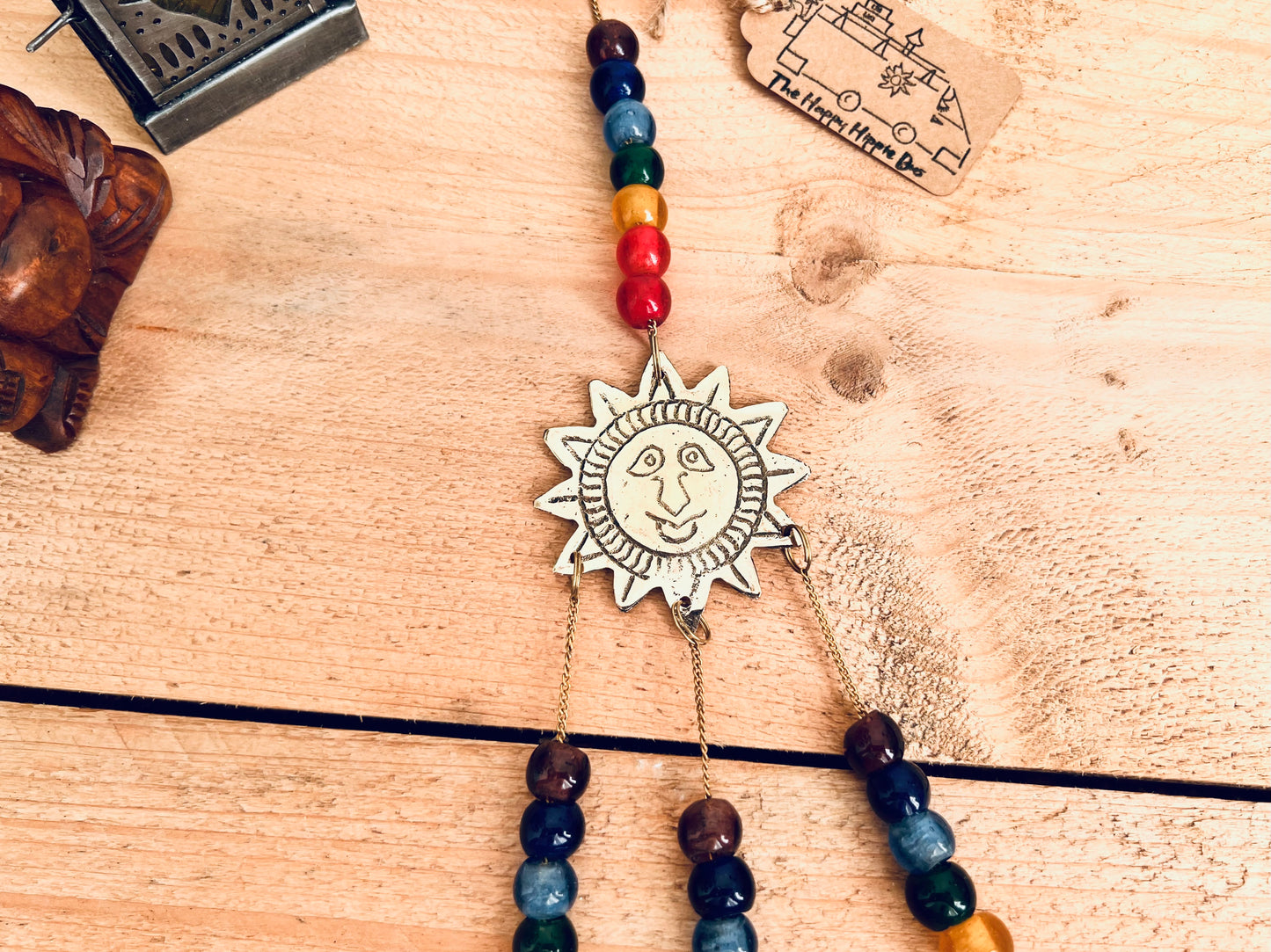 handmade mini brass sun sunshine bells, smiling sun boho hippie colourful wind chime bells, fair trade, ethical, hanging mini recycled brass bell chime