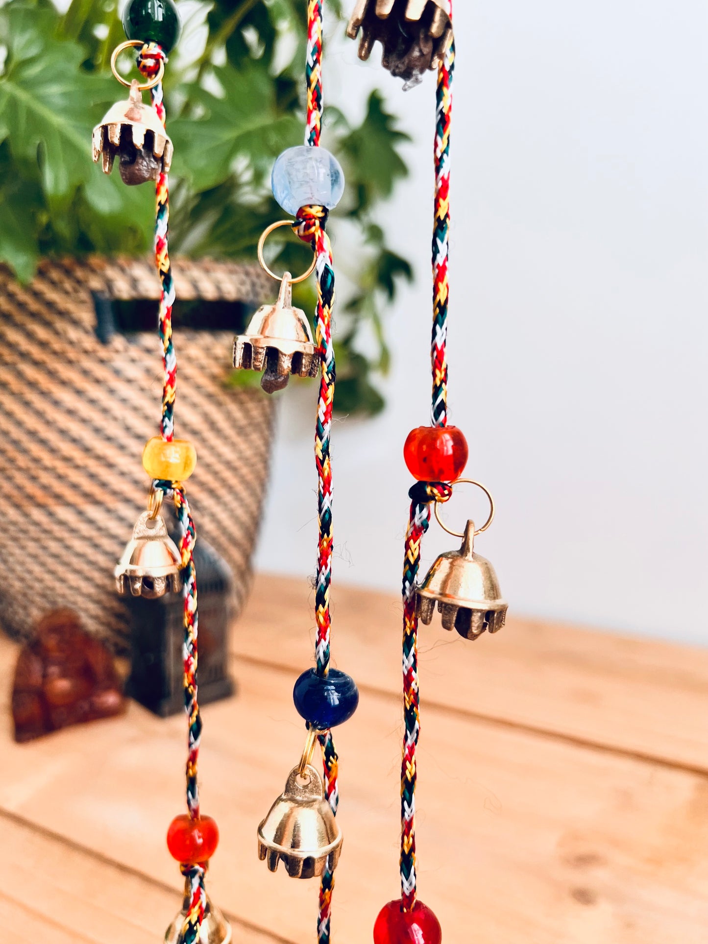 Mini brass Indian hanging string of bells, recycled metal, handmade, fair trade, ethically sourced, traditional metal wind chime bells, long garland string bells, boho, hippie, bohemian home decor