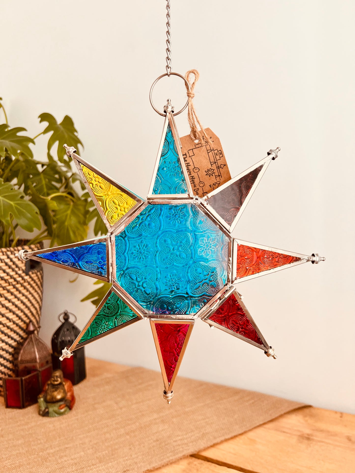 Hanging glass star Moroccan lantern with blue glass & multicoloured detail. Hanging on a long chain with metal hook hanger. Handmade bohemian hippie home glass tea-light lantern. T light candle holder. Fair trade & ethically sourced home decor.