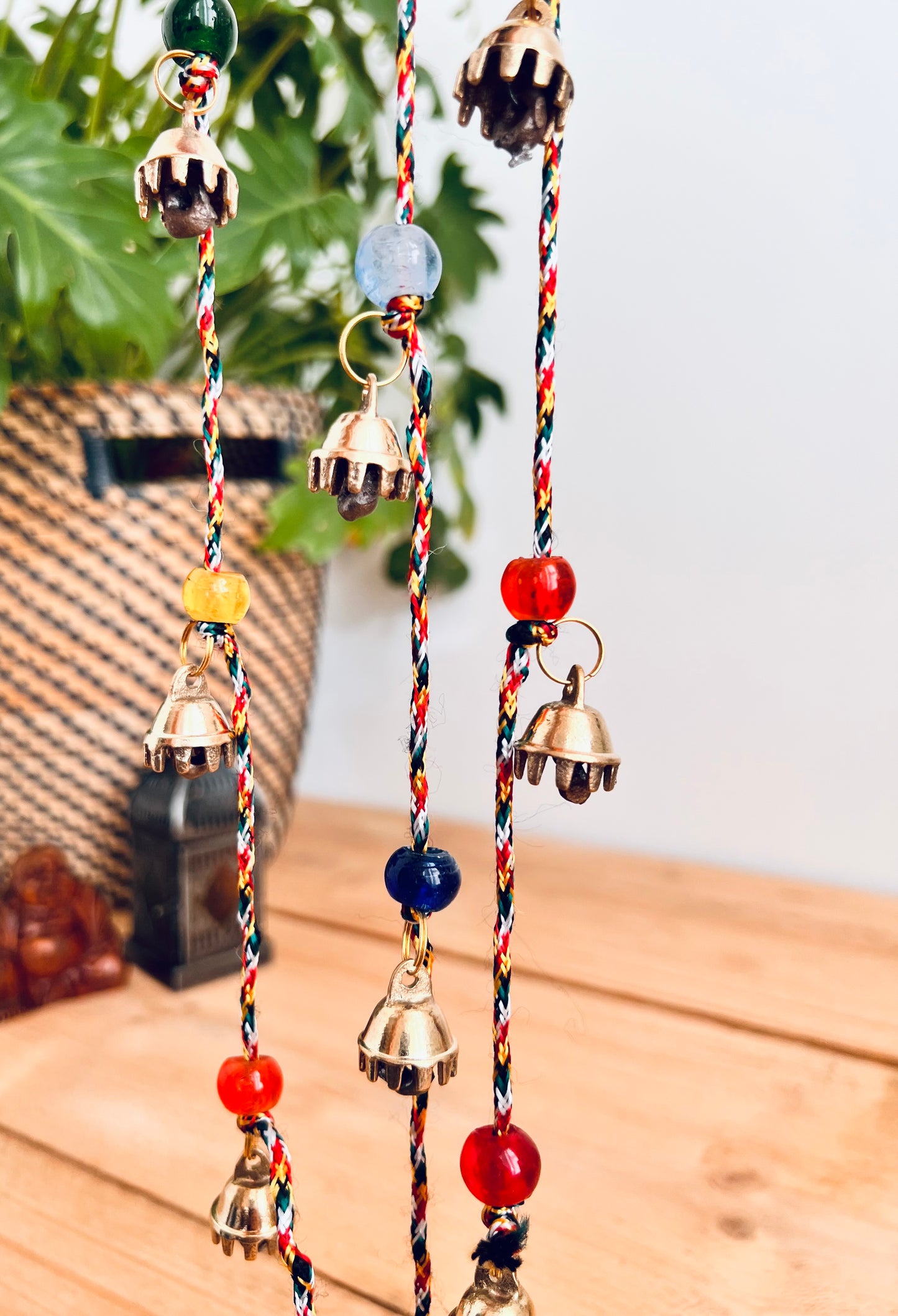 Mini brass Indian hanging string of bells, recycled metal, handmade, fair trade, ethically sourced, traditional metal wind chime bells, long garland string bells, boho, hippie, bohemian home decor