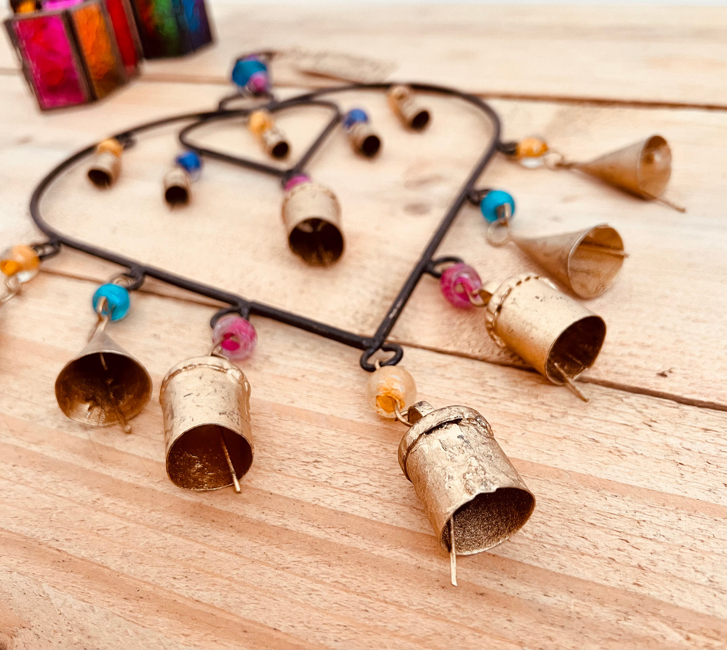 Recycled metal ironwork hanging heart bells wind chime indoor outdoor handmade fair trade boho hanging Indian bell chime, black hearts and gold bells with colourful beads wind bells