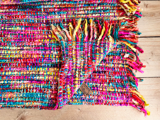 Handmade fair trade ethically sourced woven rainbow throw blanket