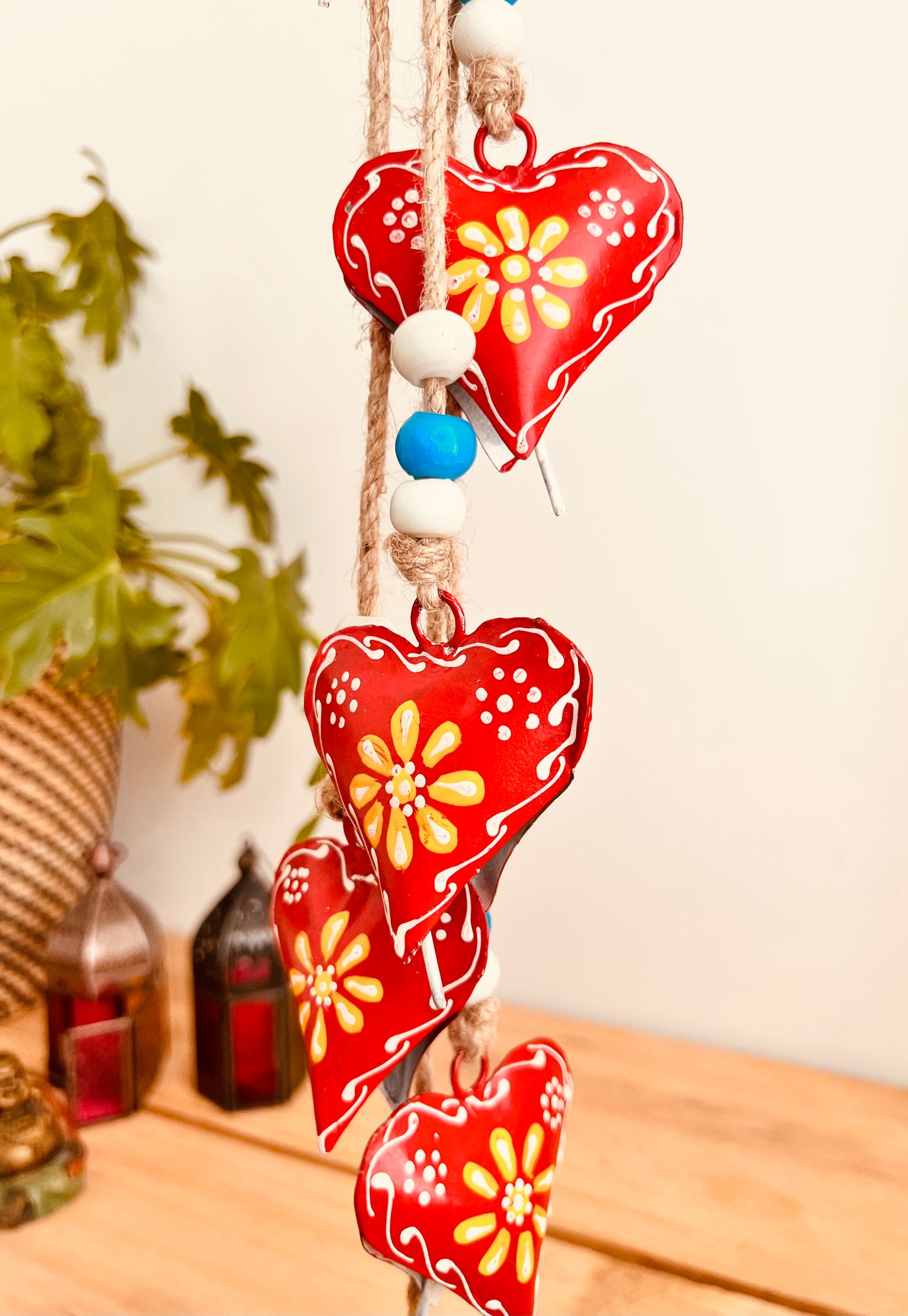 Hand painted red & yellow heart shaped metal bells wind chime on jute twine with glass beads, hanging home living decor bells chime, handmade, fair trade, ethically sourced string of Indian bells