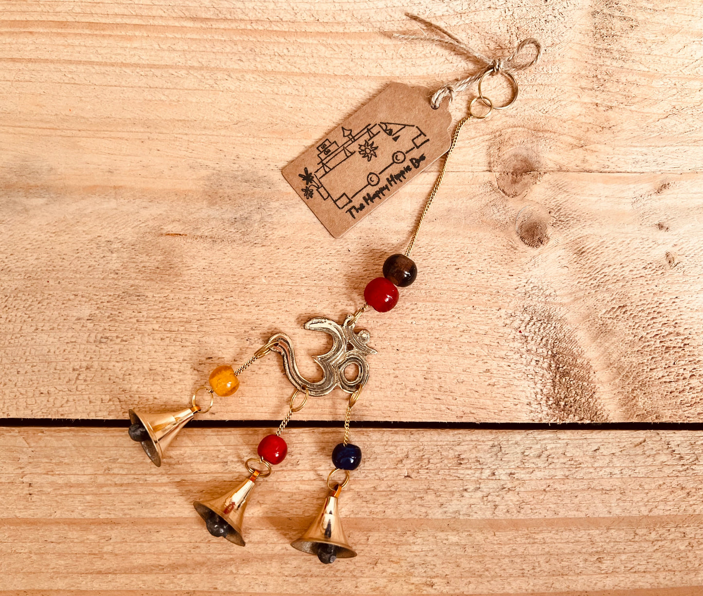 Mini brass wind chime bells Om symbol mini bell chime colourful glass beads recycled metal gold brass chime bells indoor outdoor handmade fair trade ethically sourced mini windchime