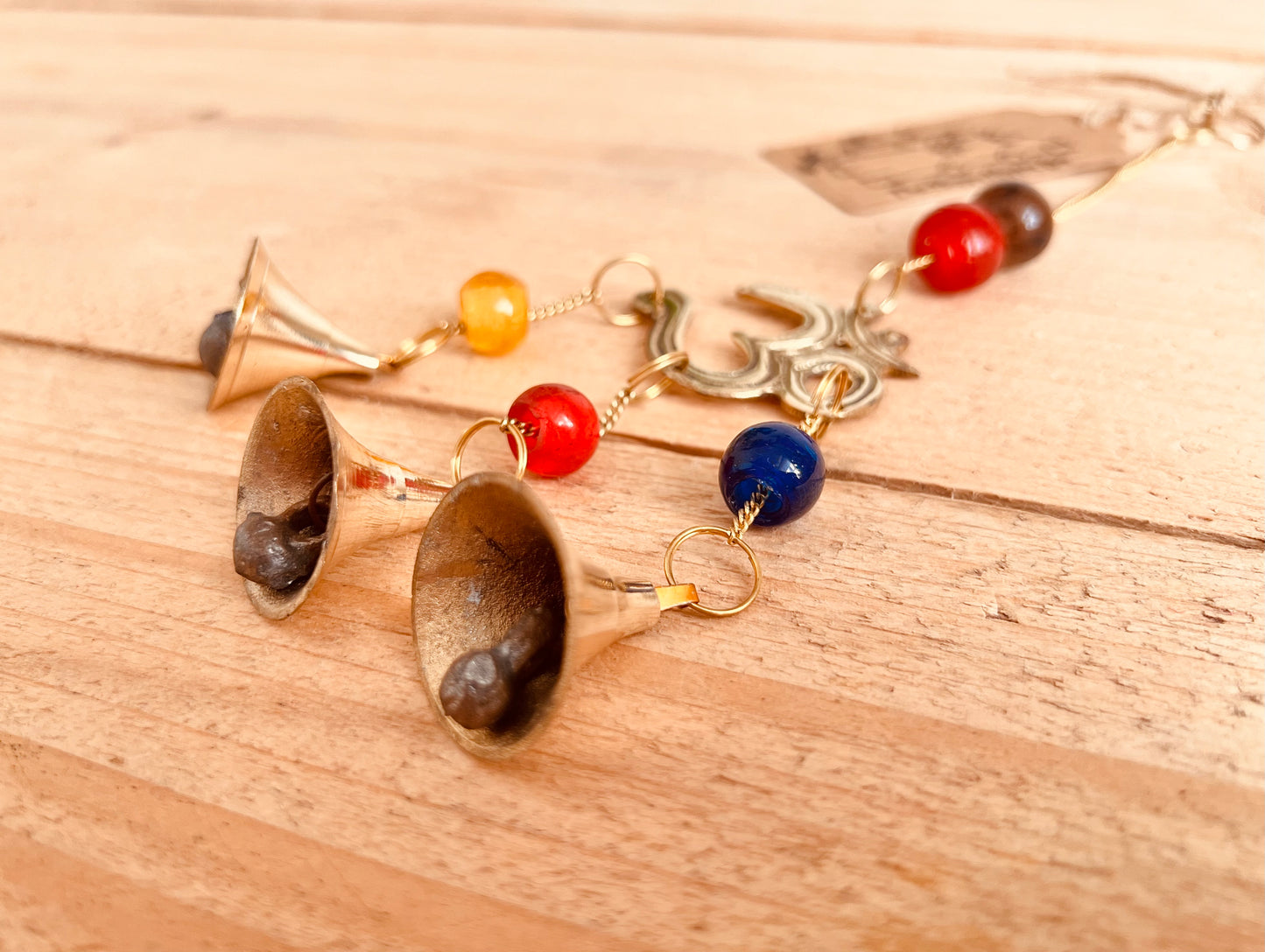 Mini brass wind chime bells Om symbol mini bell chime colourful glass beads recycled metal gold brass chime bells indoor outdoor handmade fair trade ethically sourced mini windchime