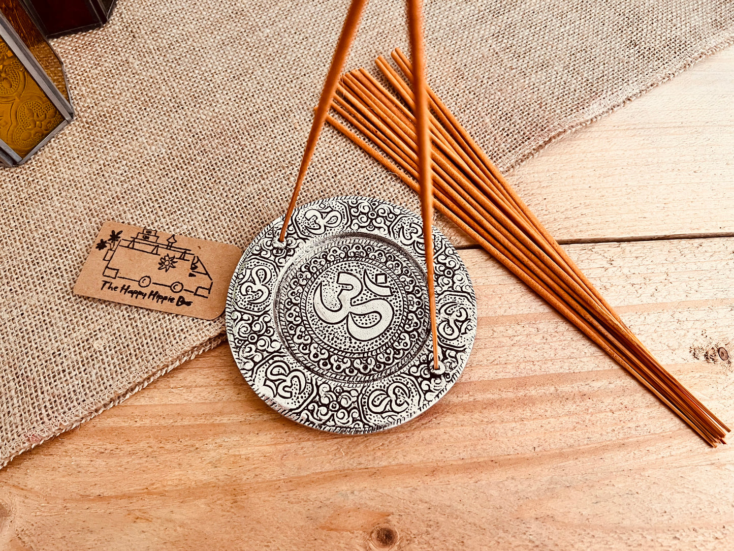 Metal plate incense stick holder burner derailed with intricate yoga Om Symbol design pattern in silver finish, handmade fair trade and ethically sourced, perfect for burning two incense sticks