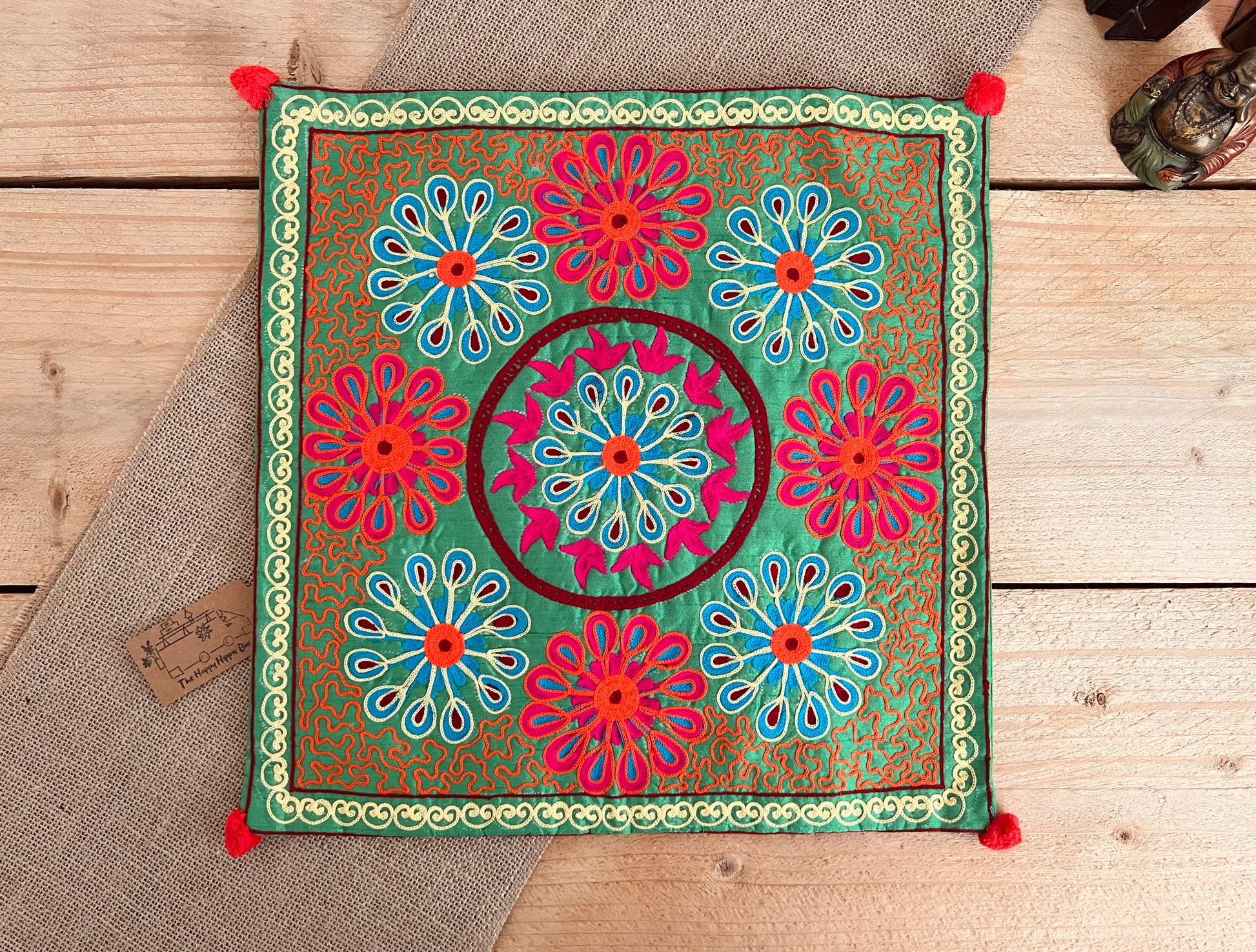 Green flower vibrant silk style fabric cushion covers with hand embroidered boho hippie chic pattern designs in three vibrant colours with Pom Pom edge detail, handmade fair trade & ethical