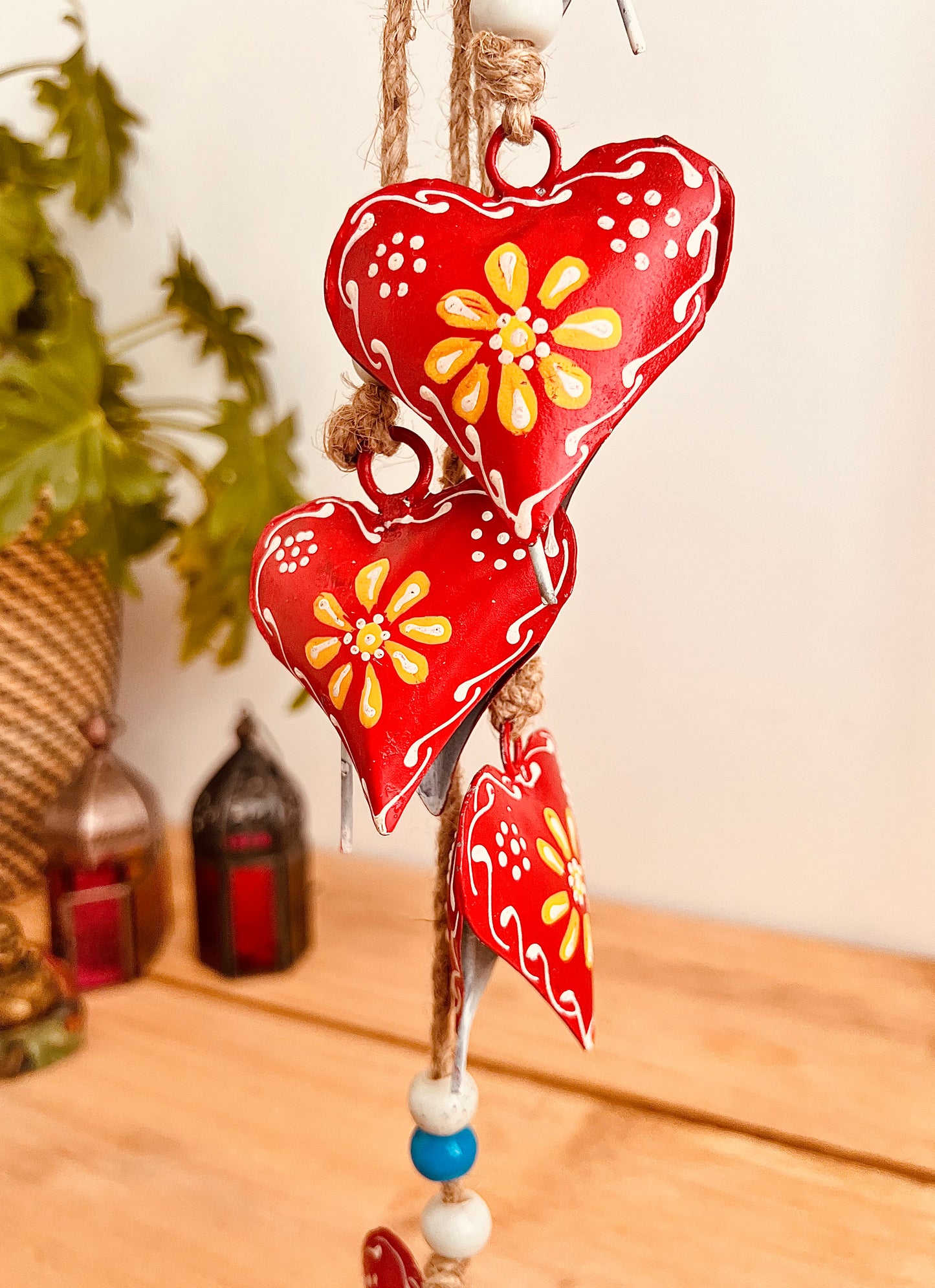 Hand painted red & yellow heart shaped metal bells wind chime on jute twine with glass beads, hanging home living decor bells chime, handmade, fair trade, ethically sourced string of Indian bells
