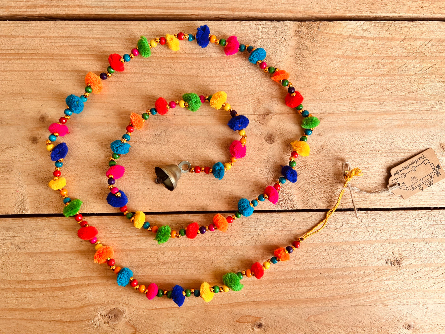 Long string of colourful handmade pom pom bells, hanging string of bells & beads, home living boho hippie decor bells, handmade, fair trade, ethically sourced