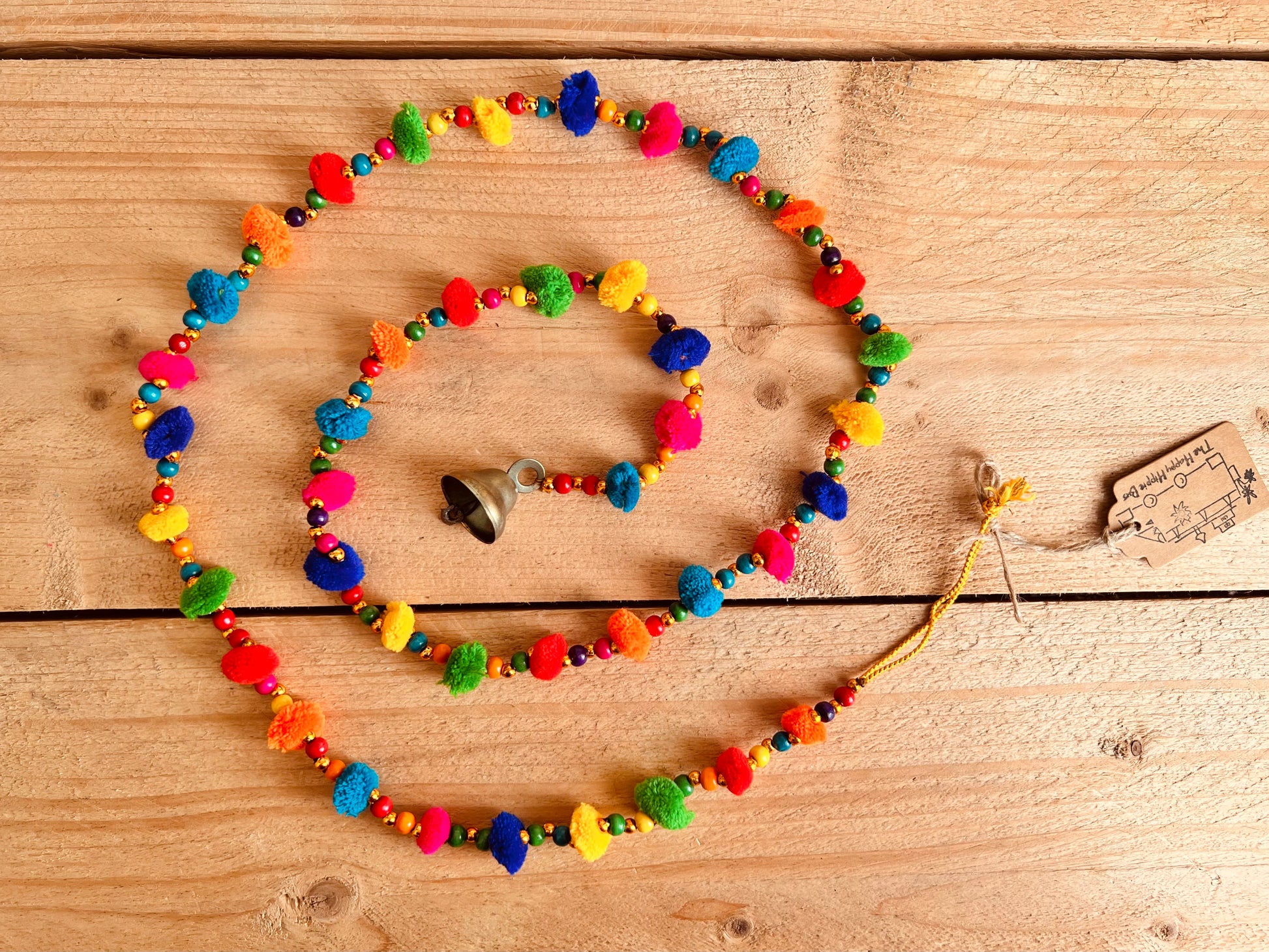 Long string of colourful handmade pom pom bells, hanging string of bells & beads, home living boho hippie decor bells, handmade, fair trade, ethically sourced