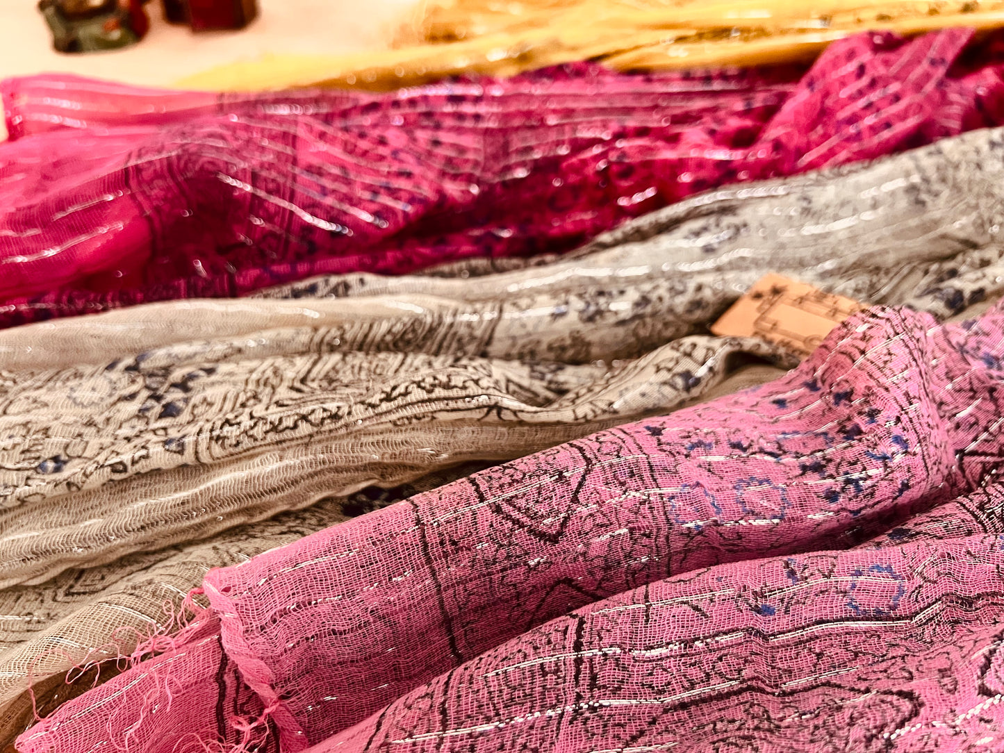 Close up of the printed boho ethnic chic pattern design on colourful Handmade lightweight boho ethnic print scarf with silver lurex thread, soft lightweight shawl scarves with tassel edge, boho hippie chic accessories 