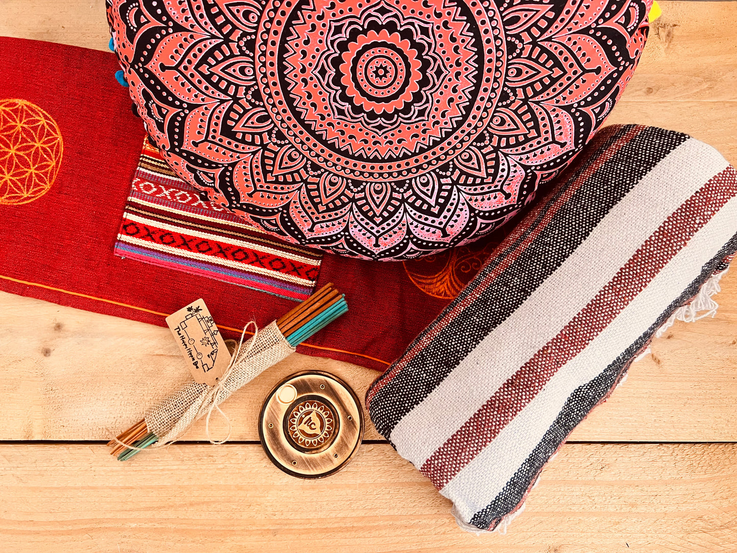 Artisan handcrafted meditation gift set in earthy red tones with yoga cushion, cotton throw, incense and holder – sustainable mindful living decor