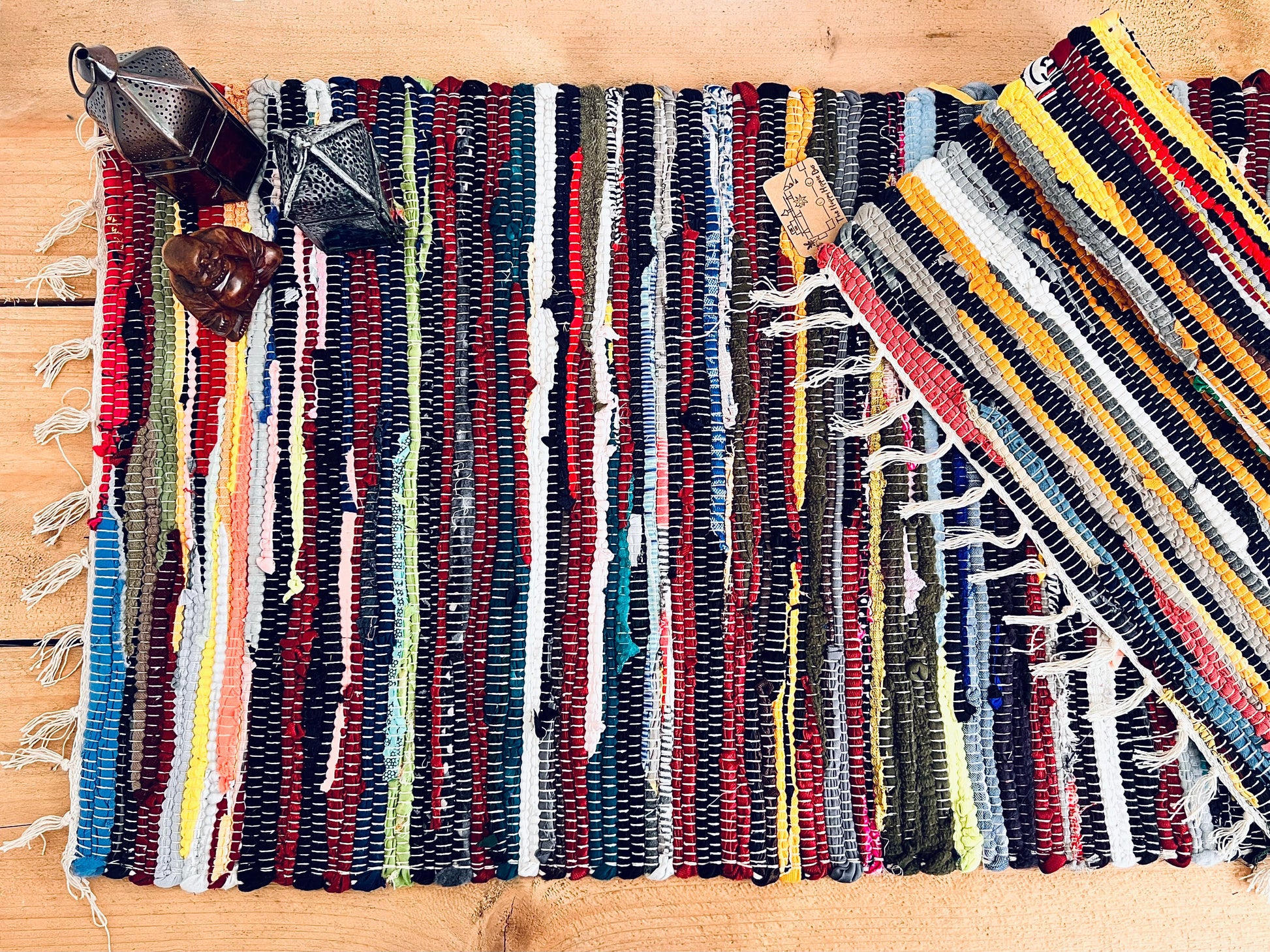 handmade fair trade recycled dark blue rag rug with tassels, small sized mini rag rug, multi coloured cotton rug, boho hippie bohemian home decor rug ethically sourced