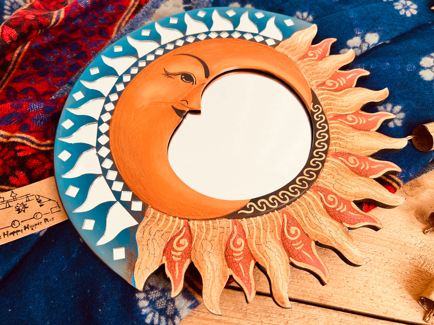 Round sun and moon mirror with hand painted details and mosaic edge