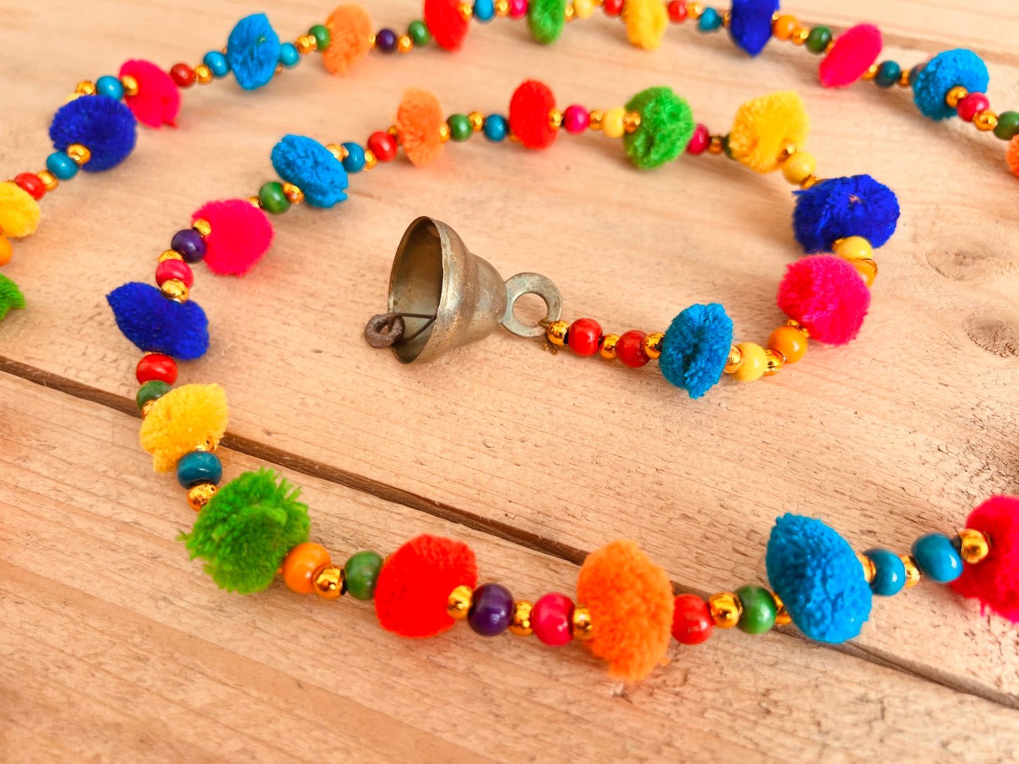 Long string of colourful handmade pom pom bells, hanging string of bells & beads, home living boho hippie decor bells, handmade, fair trade, ethically sourced