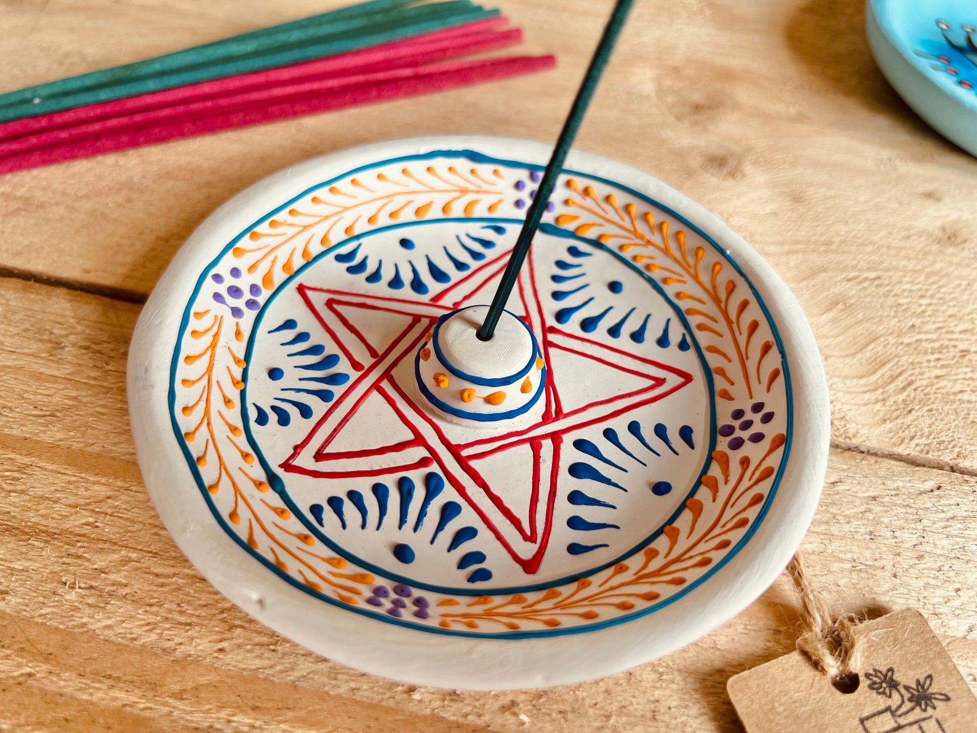 Round Clay Indian incense holder burner plate hand painted pentagram design incense tray white multicoloured painted design handmade fair trade ethically sourced 