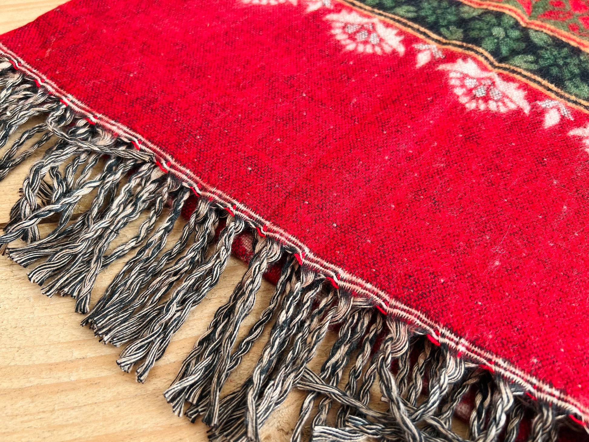 Close-up of handwoven recycled cotton
boho blanket showing textured weave