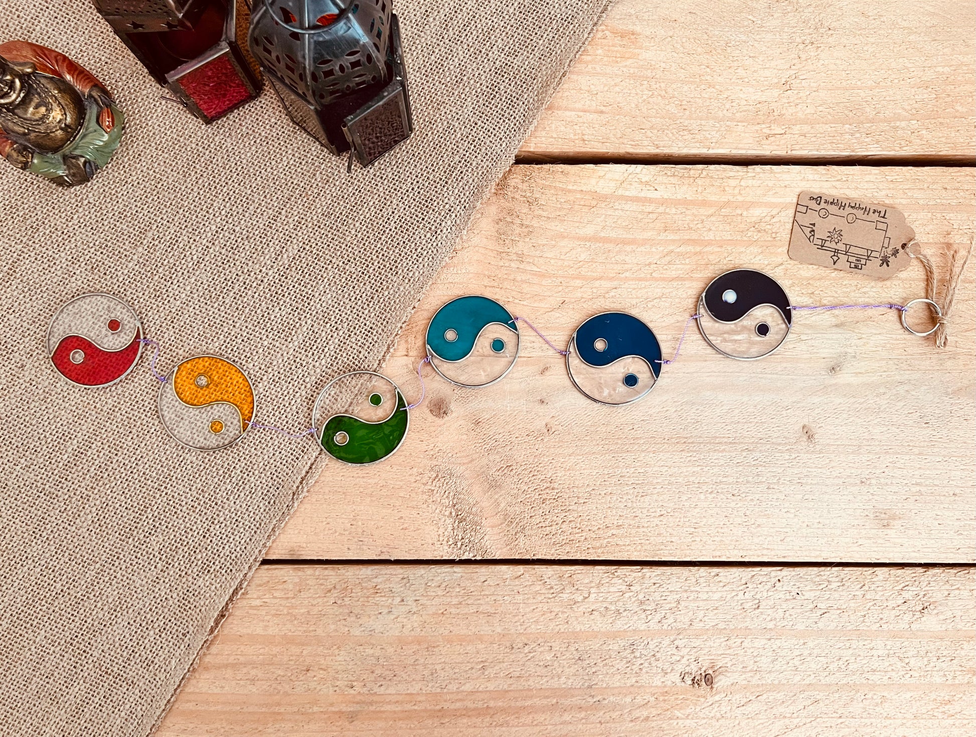 Handmade stained glass yin yang sun catcher featuring chakra colors. A unique boho gift for spiritual homes, meditation spaces, or window decor.
