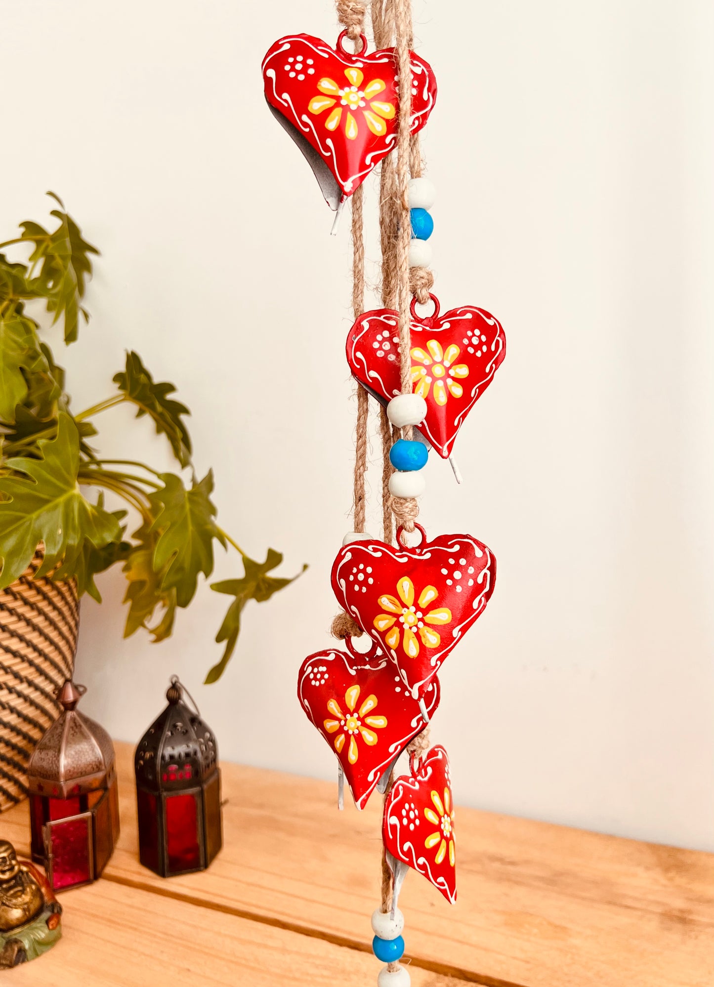 Hand painted red & yellow heart shaped metal bells wind chime on jute twine with glass beads, hanging home living decor bells chime, handmade, fair trade, ethically sourced string of Indian bells