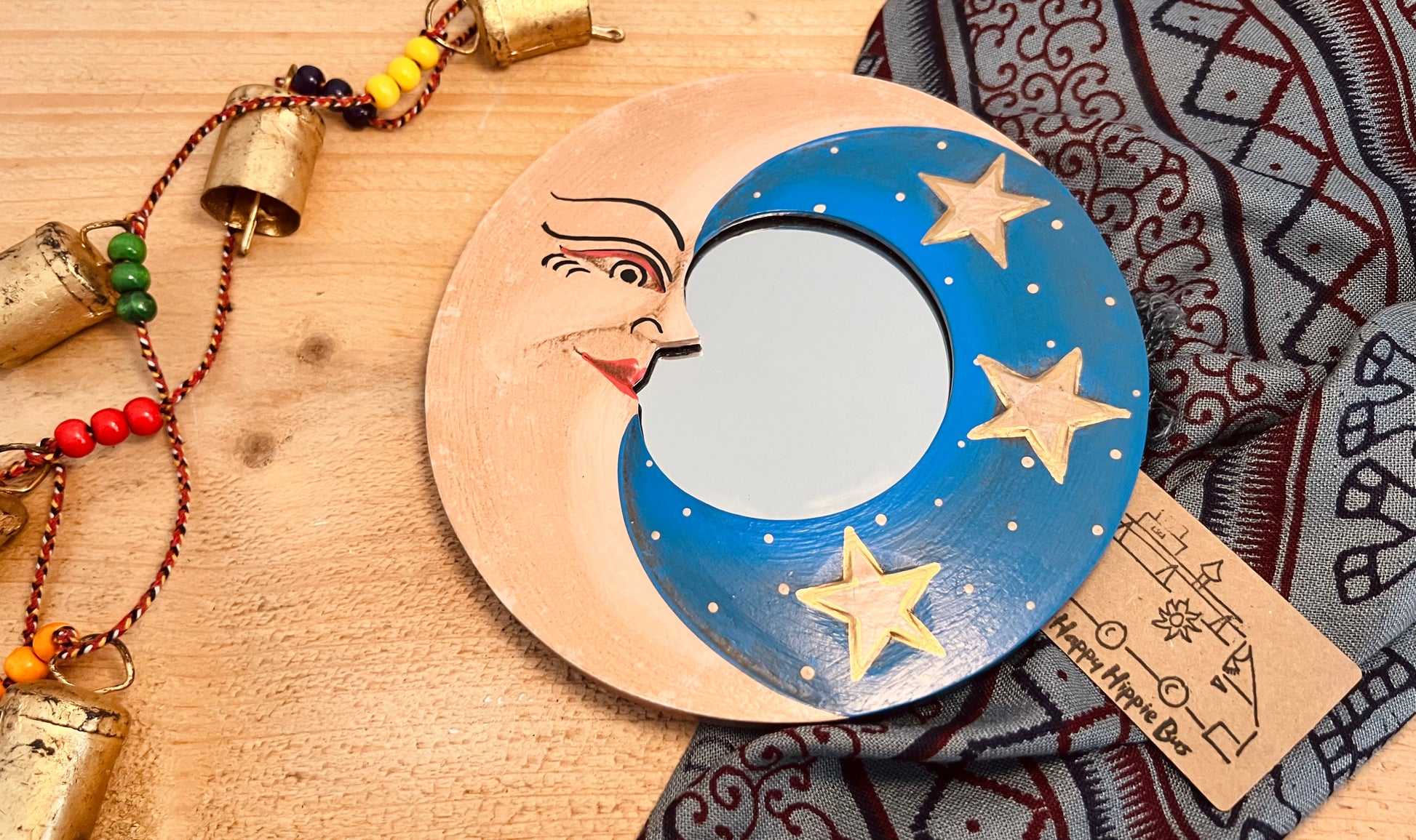 Round glass mini wooden wall hanging mirror with hippie boho moon & stars detailing in blue & yellow colour. Bohemian vintage style rustic finish small mini round wooden framed mirror. Handmade, Fair Trade, Ethical, Sustainable home decor.
