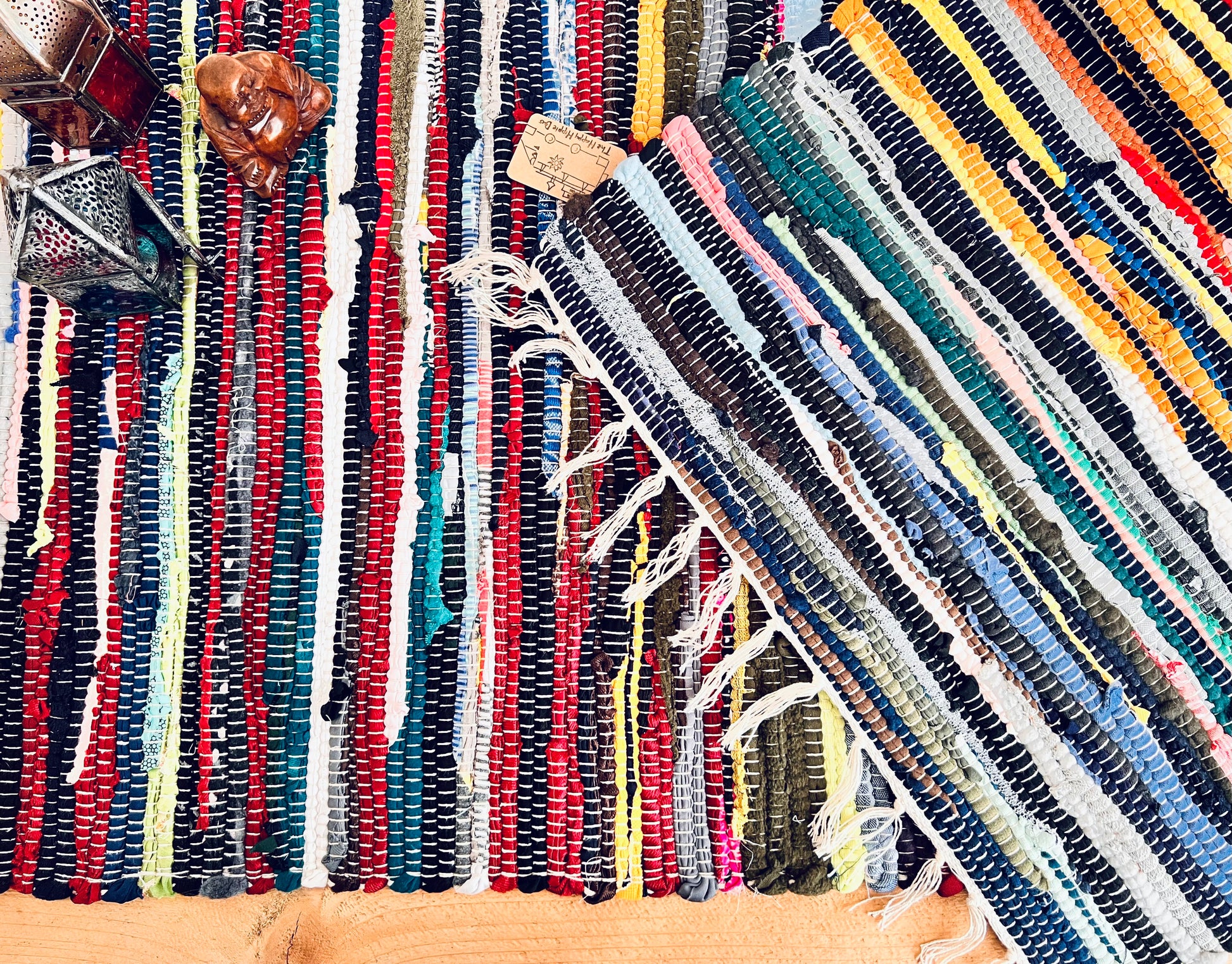 handmade fair trade recycled dark blue rag rug with tassels, small sized mini rag rug, multi coloured cotton rug, boho hippie bohemian home decor rug ethically sourced