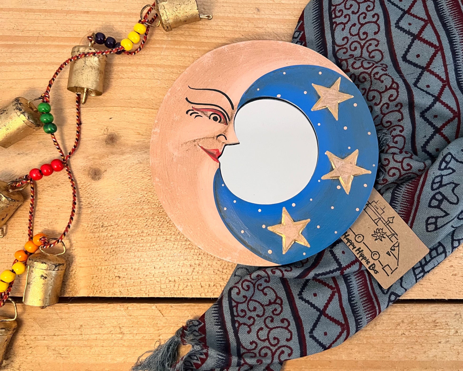 Round glass mini wooden wall hanging mirror with hippie boho moon & stars detailing in blue & yellow colour. Bohemian vintage style rustic finish small mini round wooden framed mirror. Handmade, Fair Trade, Ethical, Sustainable home decor.