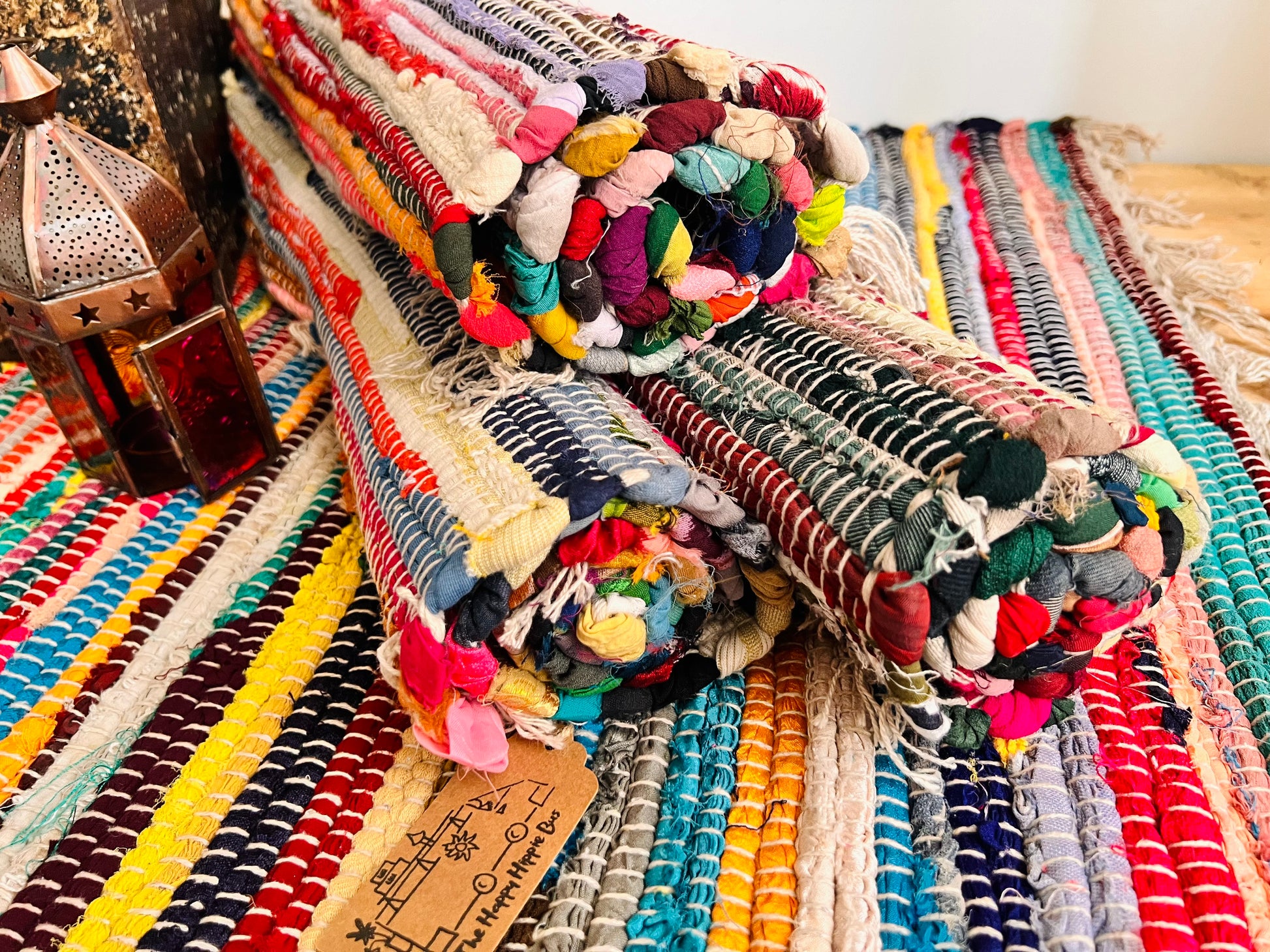 Handmade fair trade recycled fabric chindi dari rag rug eco cotton tassel ethically sourced boho hippie home decor multicoloured rug 