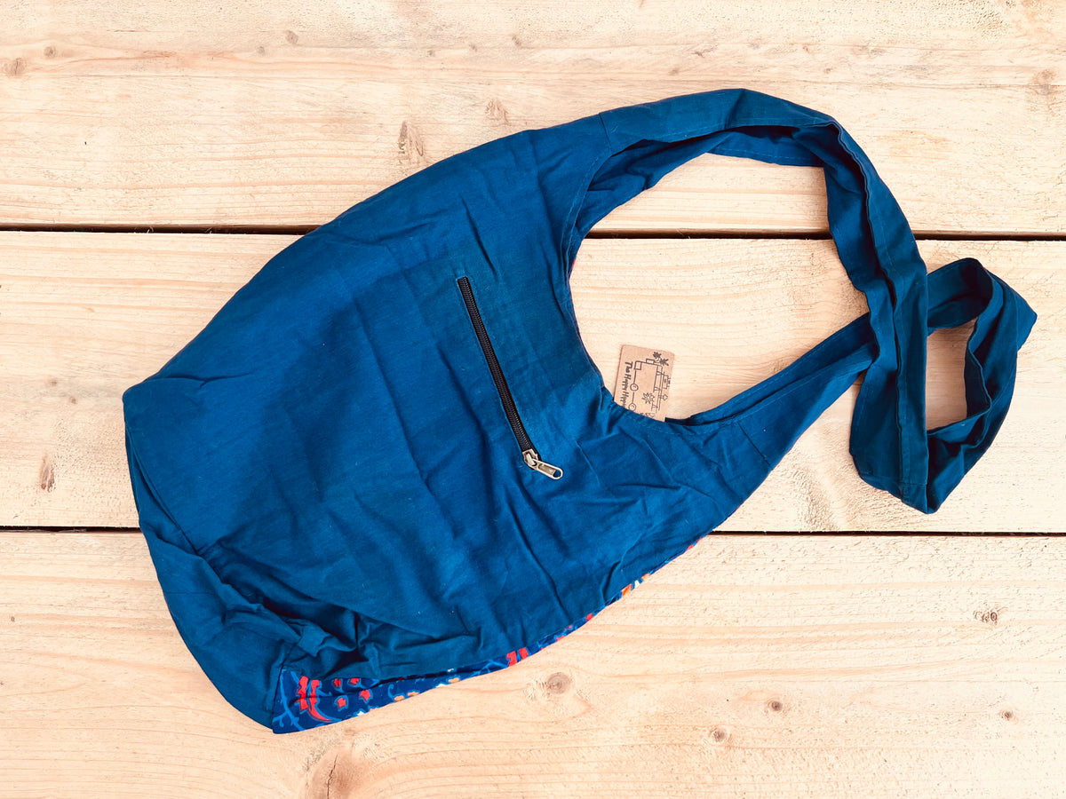 Rear of Shoulder bag in peacock mandala print design with zipper back pocket, blue cotton hand printed boho shoulder cross body bag, handmade fair trade hippie bag, ethical fair trade accessories 
