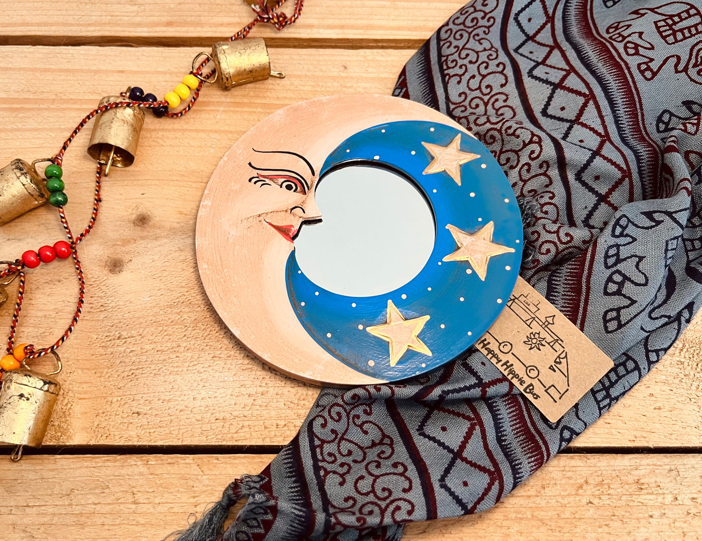 Round glass mini wooden wall hanging mirror with hippie boho moon & stars detailing in blue & yellow colour. Bohemian vintage style rustic finish small mini round wooden framed mirror. Handmade, Fair Trade, Ethical, Sustainable home decor.
