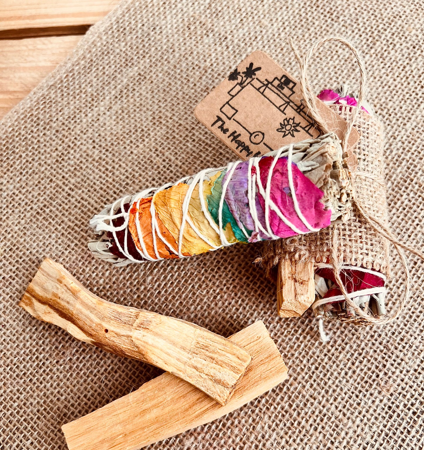 White sage smudge sticks with colourful rose petals wrapped with Palo Santo sticks, home fragrance, cleansing ritual incense 