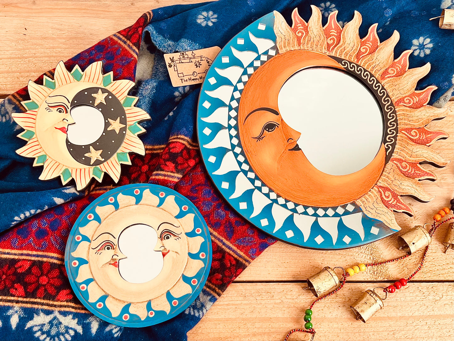 Close up image of set of three sun, crescent moon & star wooden wall mirrors, handmade colourful boho wall hanging mirrors, boho hippie home decor