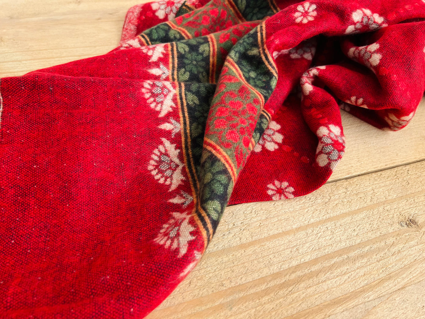 Fair trade recycled cotton throw blanket showing red floral bohemian pattern