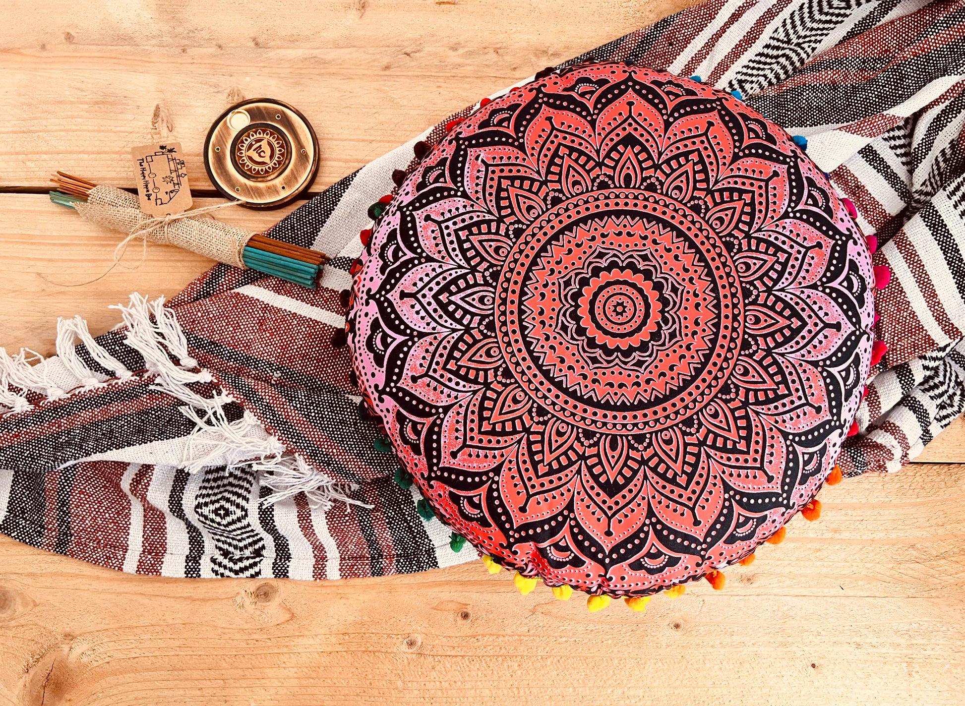 Artisan handcrafted meditation gift set in earthy red tones with yoga cushion, cotton throw, incense and holder – sustainable mindful living decor