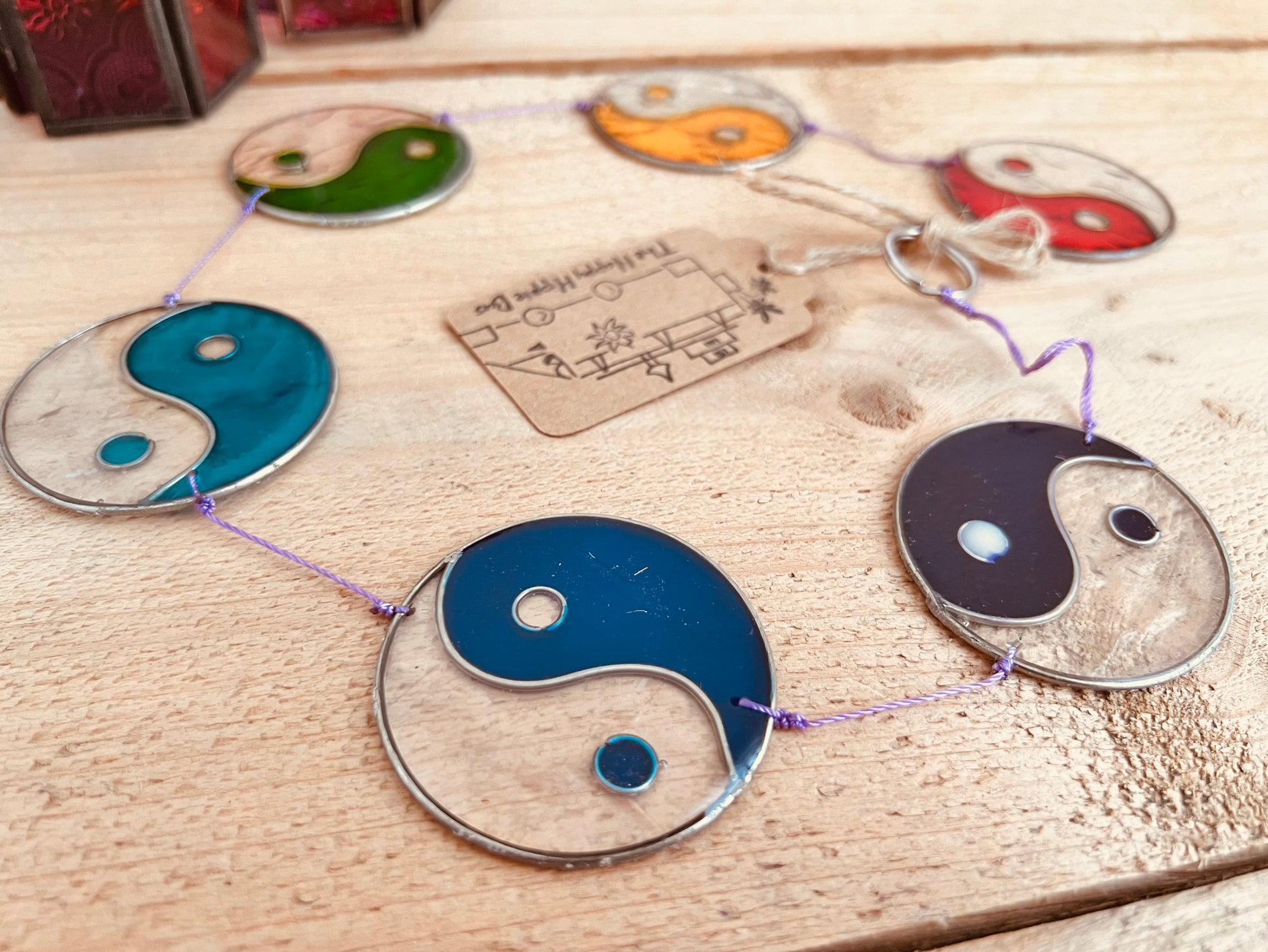 Boho stained glass yin yang window hanging in rainbow chakra colours for meditation and balance