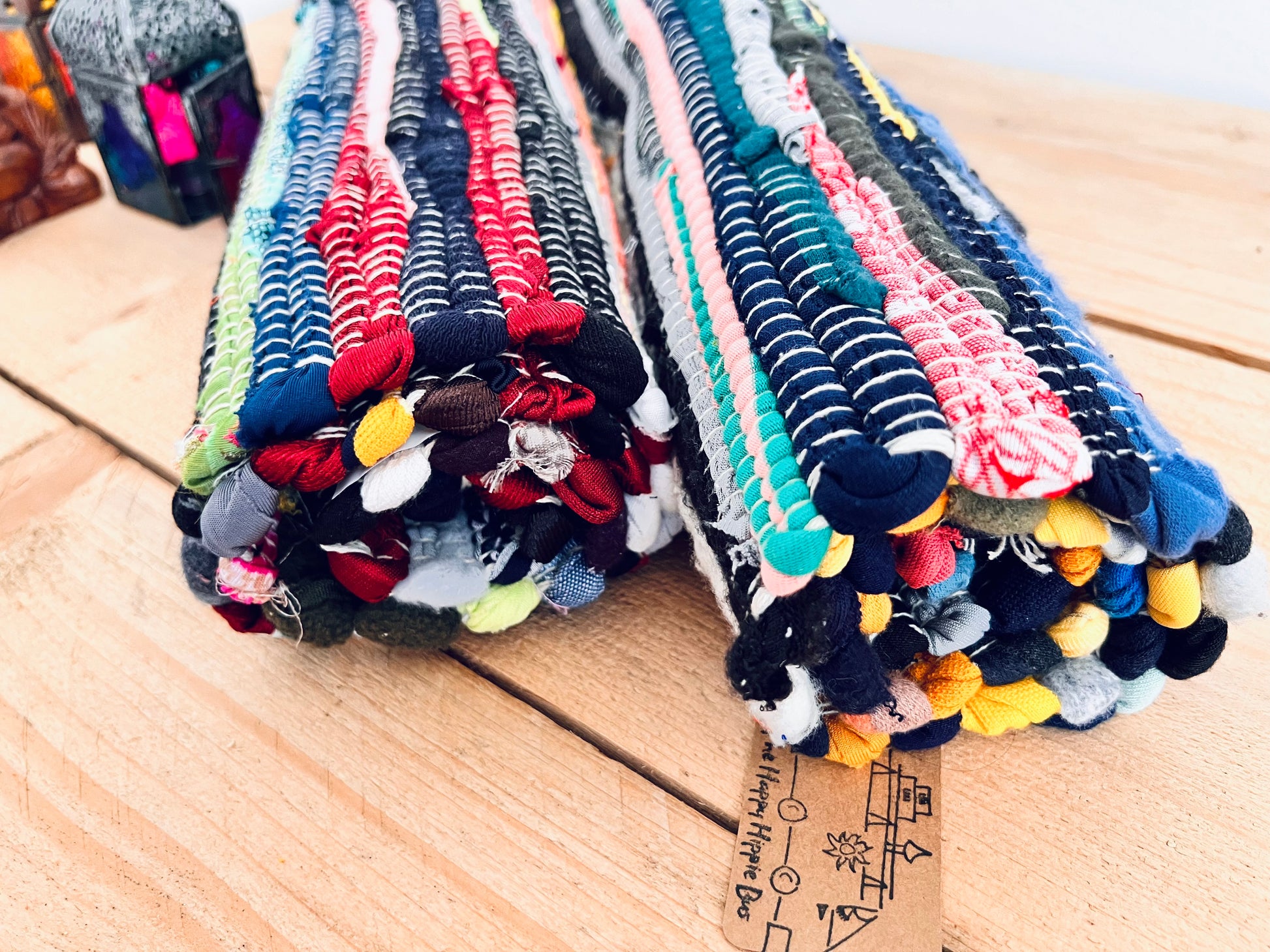 handmade fair trade recycled dark blue rag rug with tassels, small sized mini rag rug, multi coloured cotton rug, boho hippie bohemian home decor rug ethically sourced