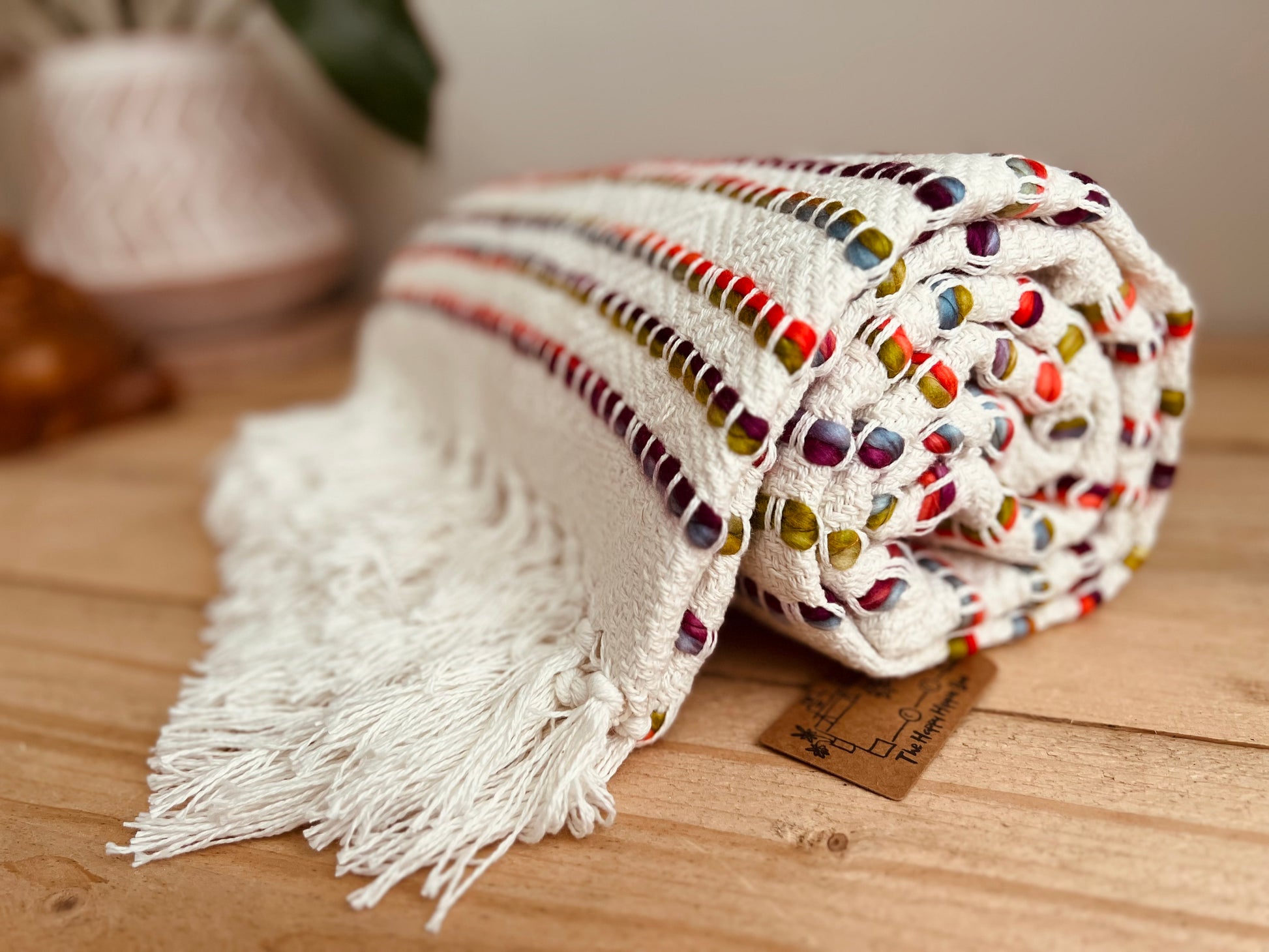 Handmade fair trade ethical cotton chair sofa tassel throw white and rainbow 