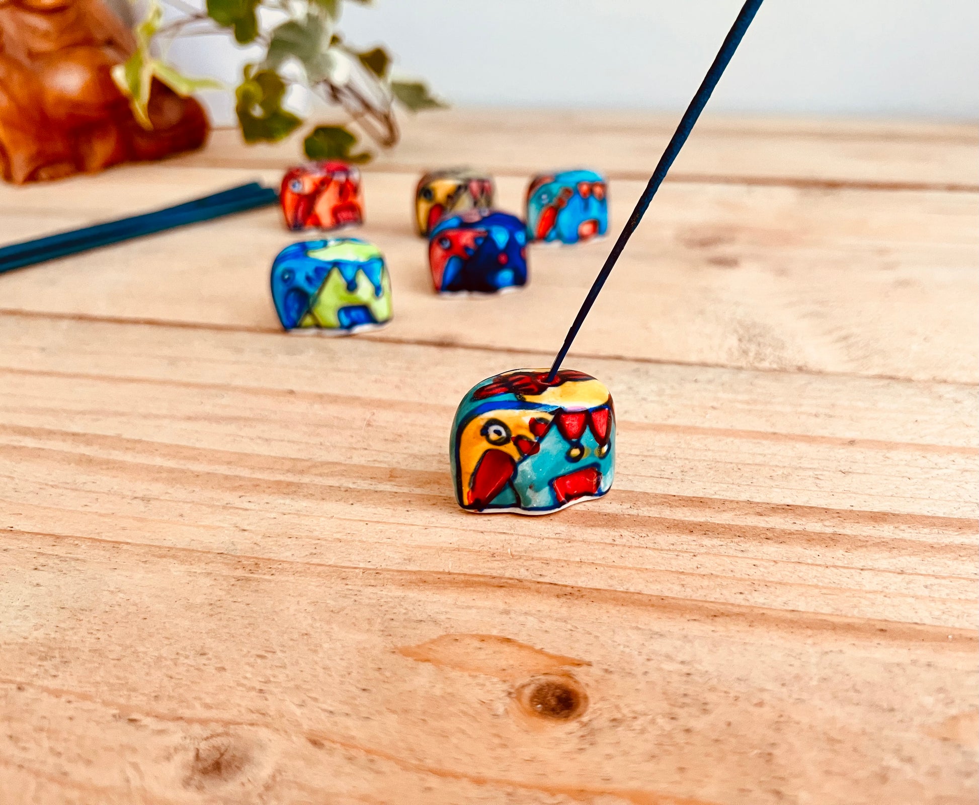 Blue, yellow & red Mini ceramic elephant incense stick holder burner in colourful hand painted designs, handmade fair trade & ethically sourced home decor & home fragrance 
