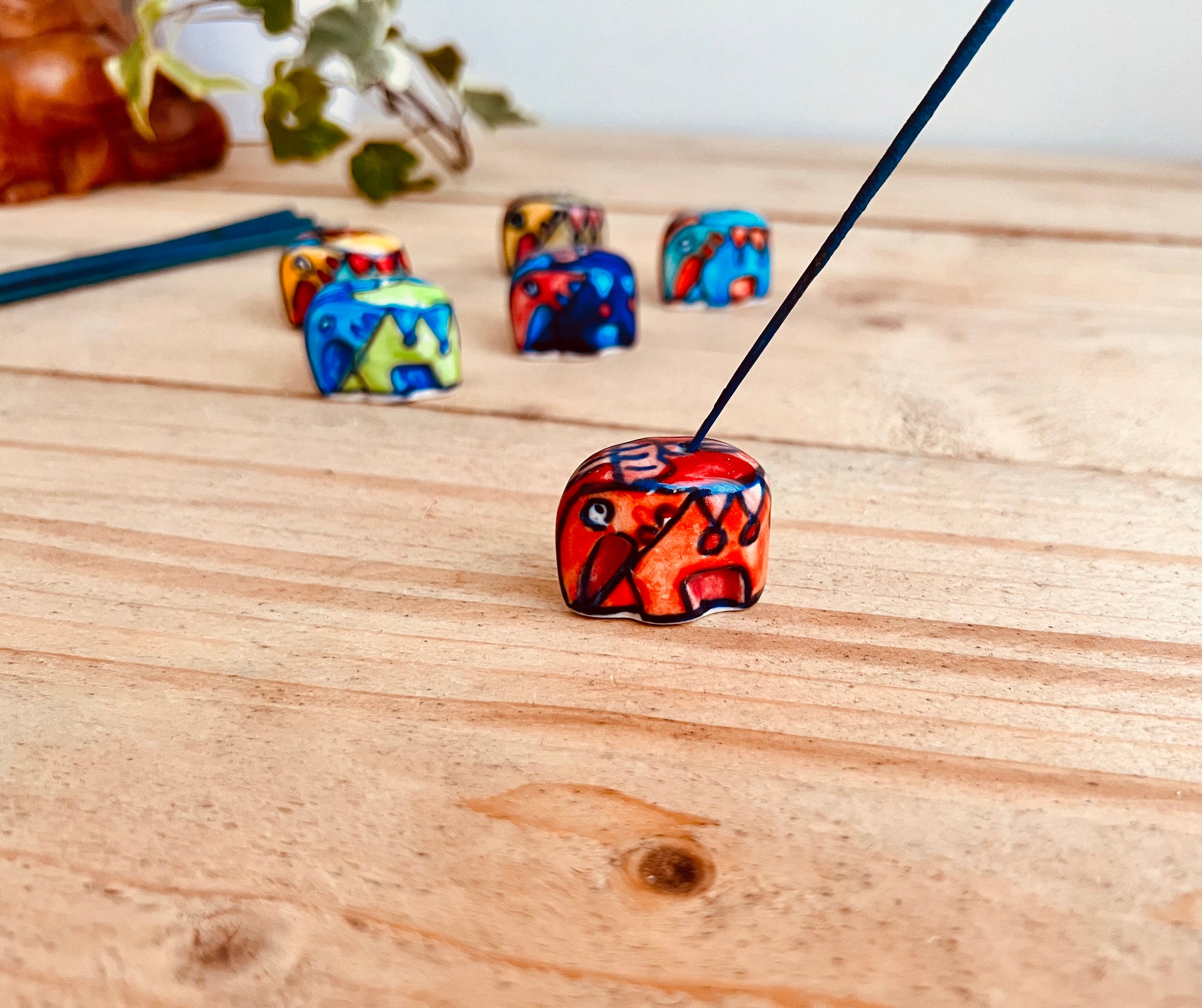 Burnt orange Mini ceramic elephant incense stick holder burner in colourful hand painted designs, handmade fair trade & ethically sourced home decor & home fragrance 