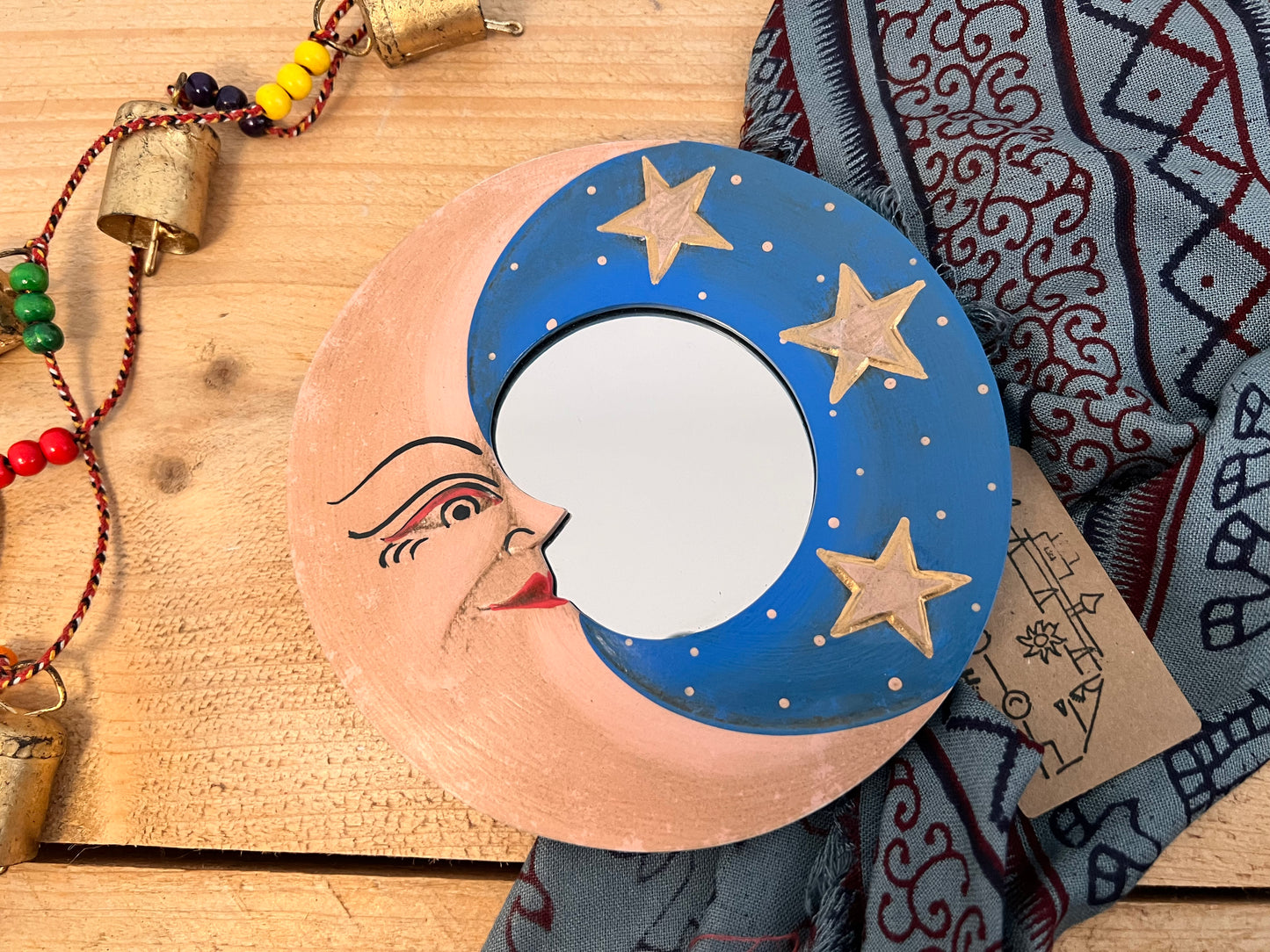 mini wooden wall hanging mirror with hippie boho moon & stars detailing in blue & yellow colour. Bohemian vintage style rustic finish small mini round wooden framed mirror. Handmade, Fair Trade, Ethical, Sustainable home decor.