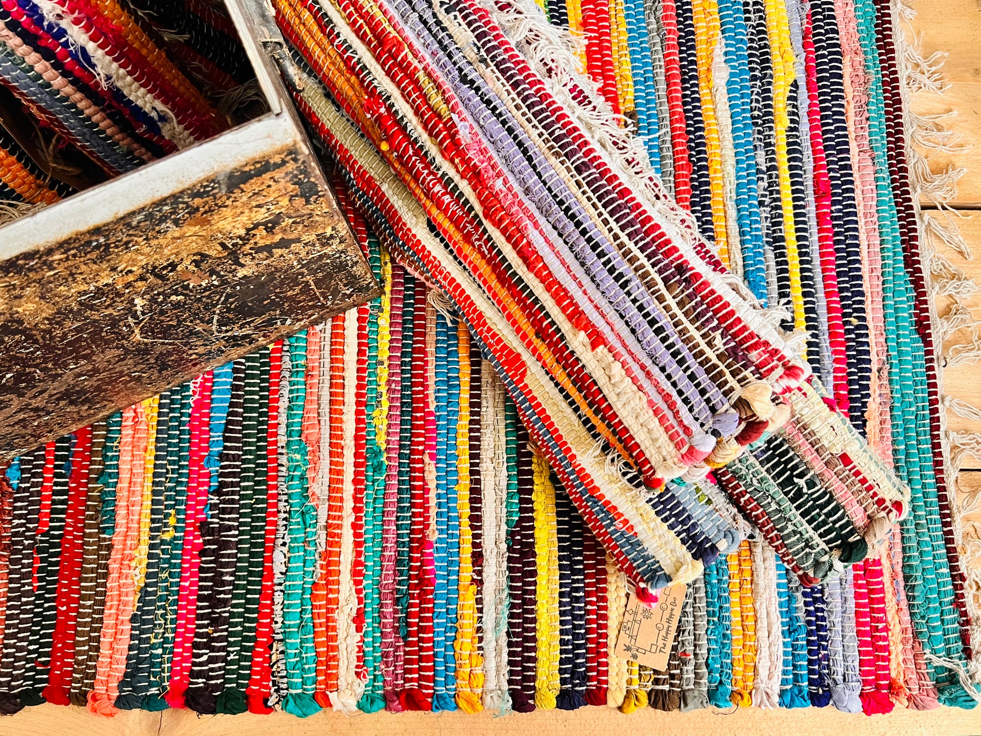 Handmade fair trade recycled fabric chindi dari rag rug eco cotton tassel ethically sourced boho hippie home decor multicoloured rug 